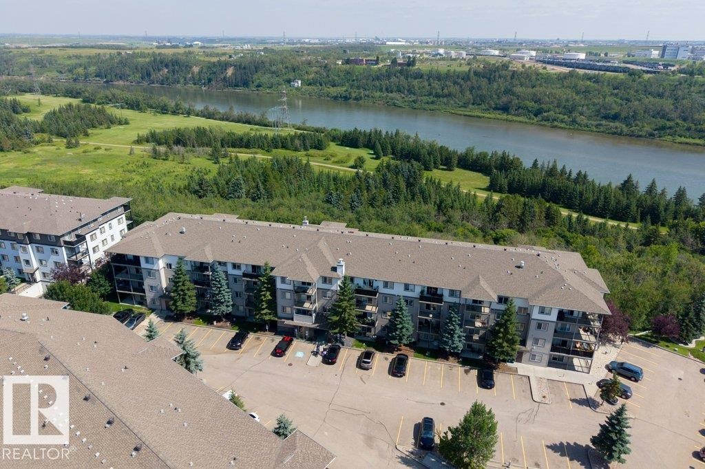 Multi-story residential buildings with surface parking - #307 1188 Hyndman Rd Nw, Edmonton, AB - Outdoor With Body Of Water With View