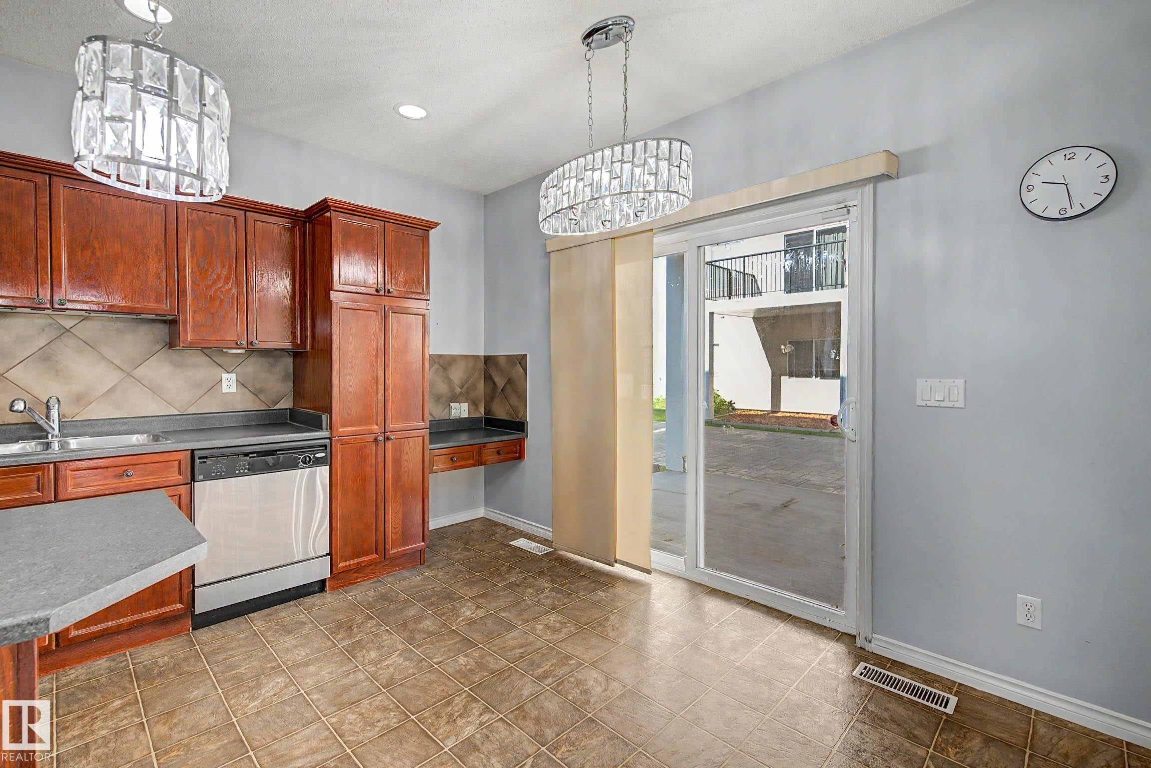 #47 13825 155 Av Nw, Edmonton, AB - Indoor Photo Showing Kitchen With Double Sink