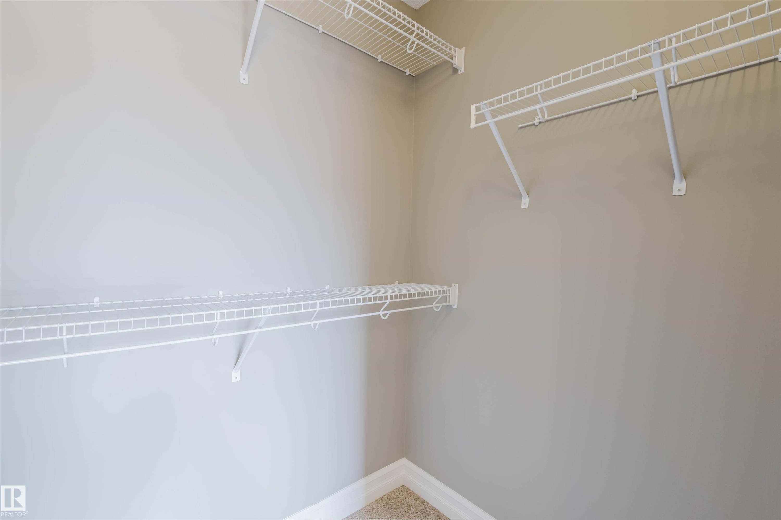 Built-in wire shelving and hanging rods - 15839 10 Avenue Sw, Edmonton, AB - Indoor With Storage