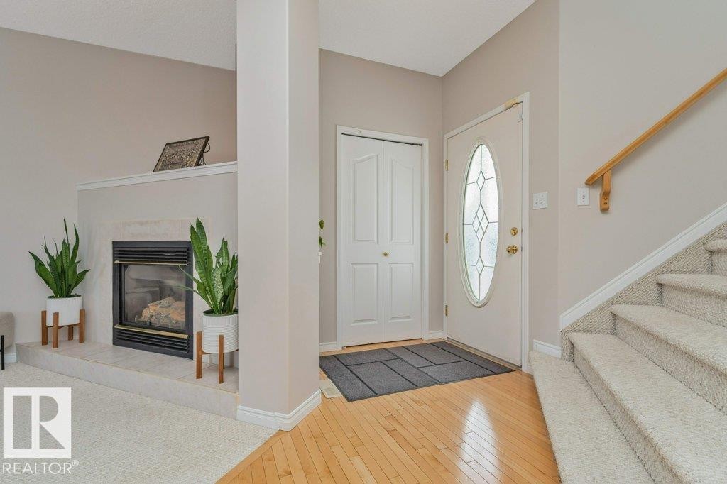 1072 Barnes Way Sw, Edmonton, AB - Indoor Photo Showing Other Room With Fireplace