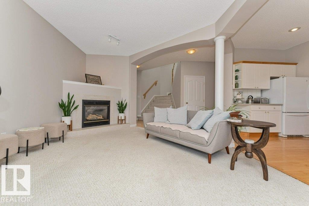 1072 Barnes Way Sw, Edmonton, AB - Indoor Photo Showing Living Room With Fireplace