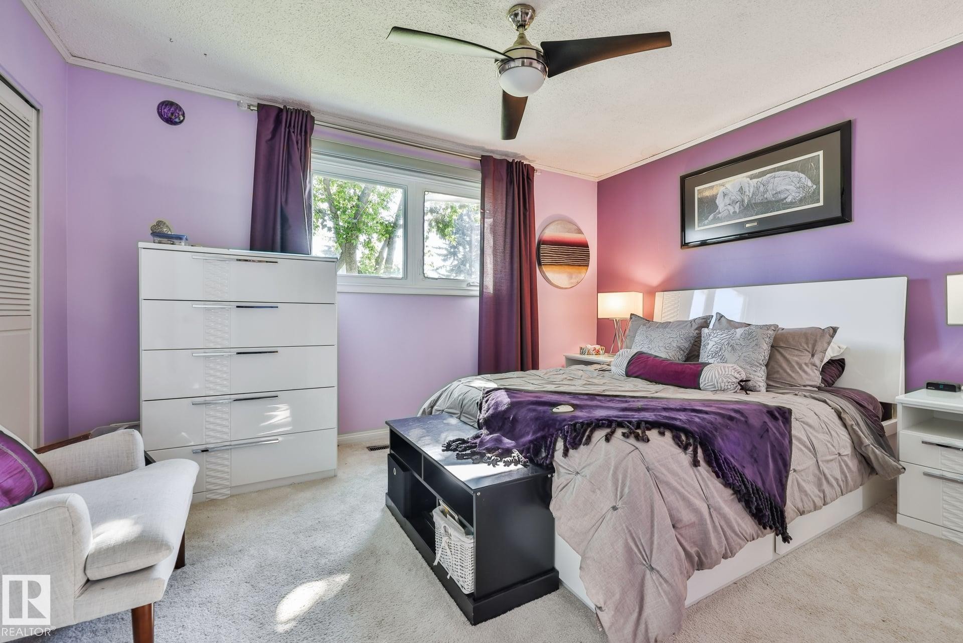 Recessed window featuring white trim and purple drapes - 8932 187 Street Nw, Edmonton, AB - Indoor Photo Showing Bedroom
