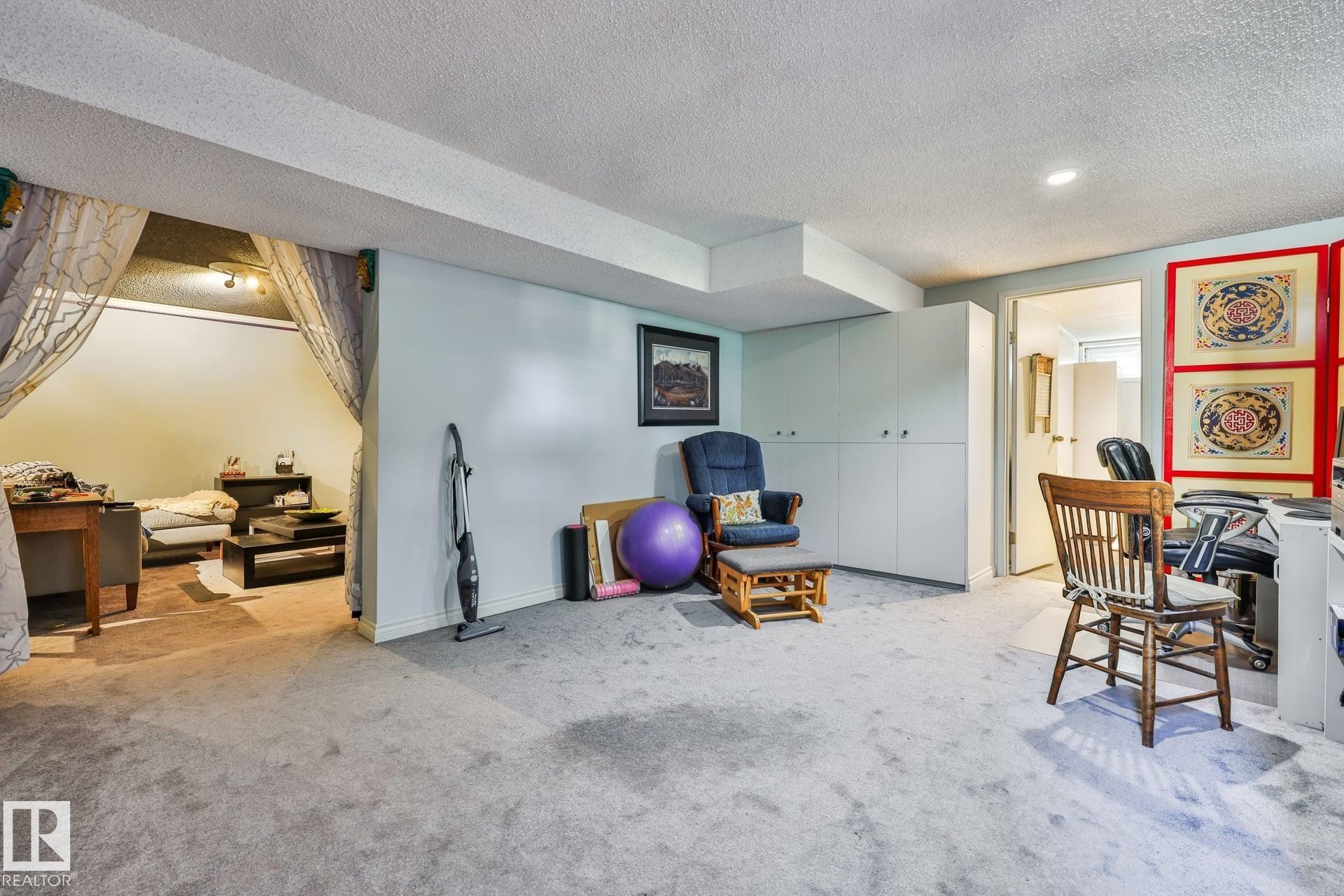 Recessed lighting, light-toned carpeting, built-in cabinetry, and a separate carpeted area - 8932 187 Street Nw, Edmonton, AB - Indoor