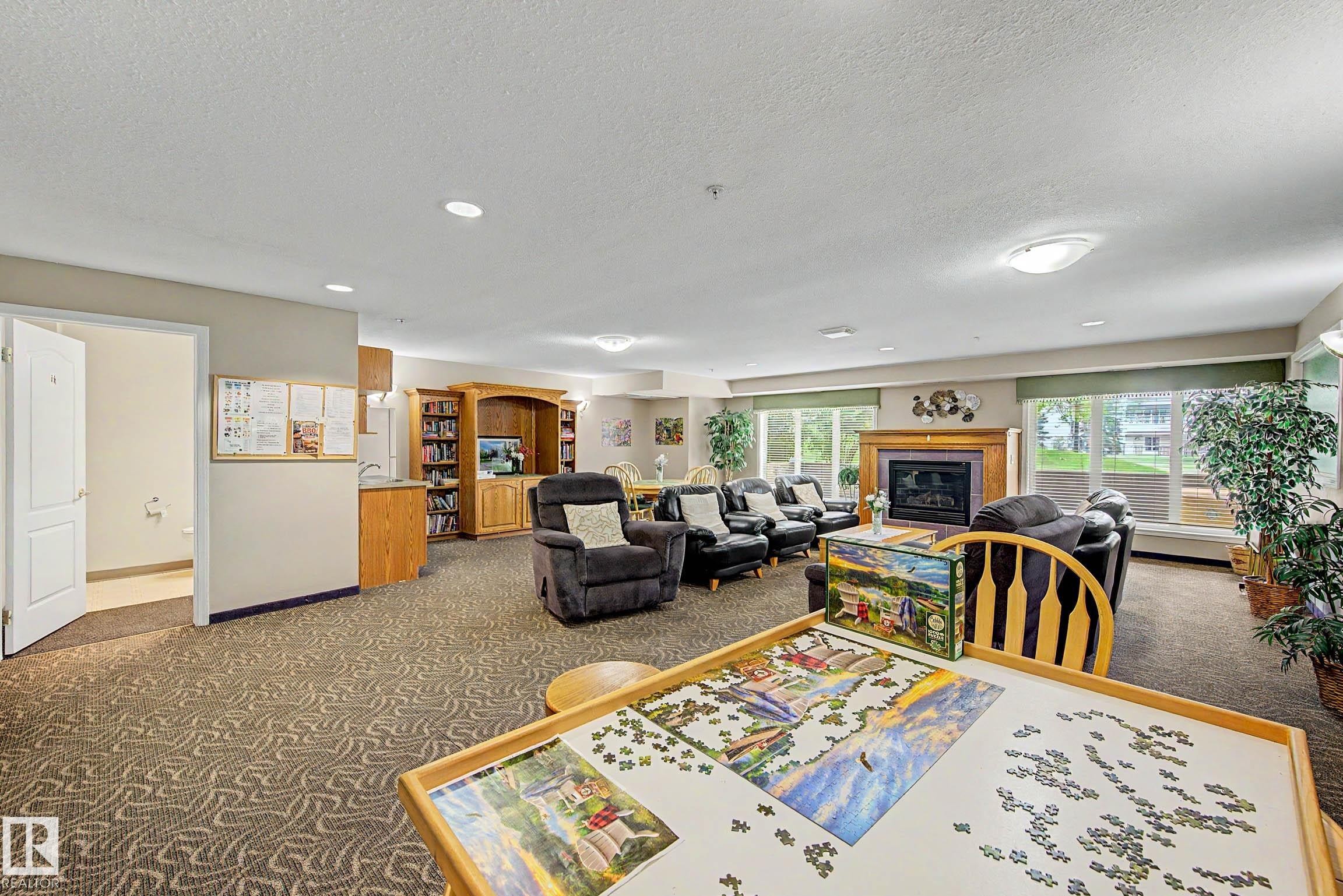 #209 237 Youville Dr E Nw, Edmonton, AB - Indoor With Fireplace