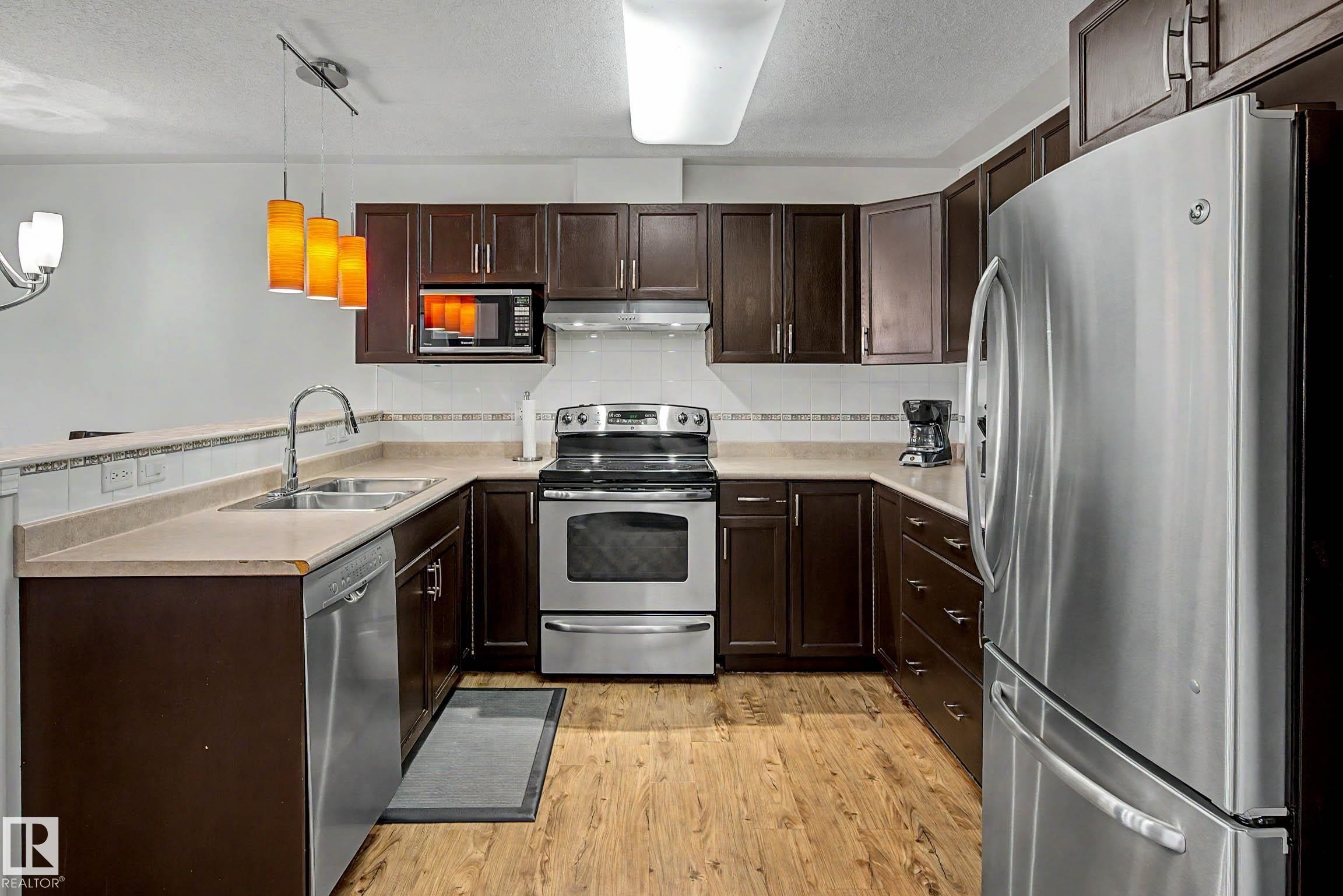 #209 237 Youville Dr E Nw, Edmonton, AB - Indoor Photo Showing Kitchen With Double Sink