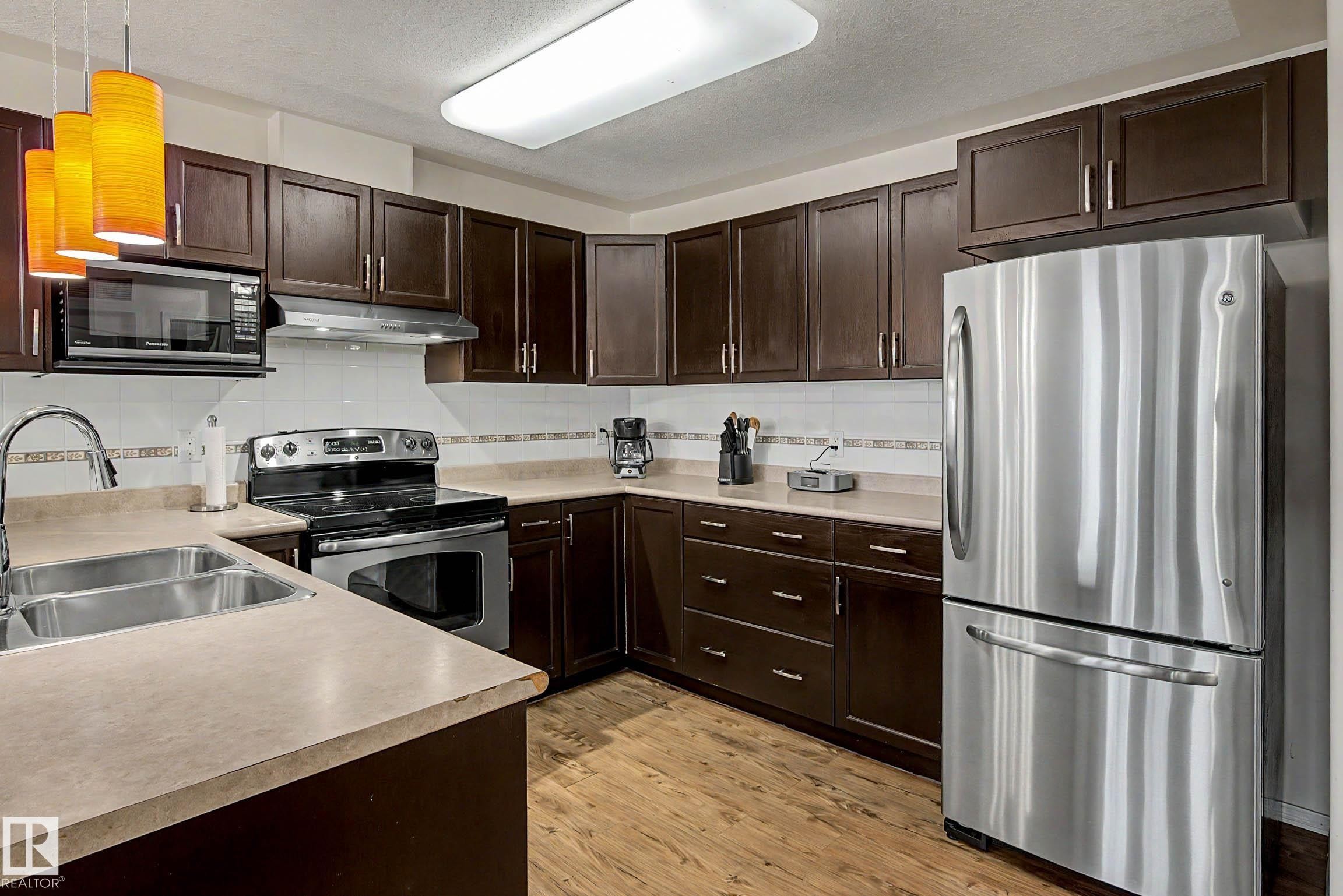 #209 237 Youville Dr E Nw, Edmonton, AB - Indoor Photo Showing Kitchen With Double Sink With Upgraded Kitchen