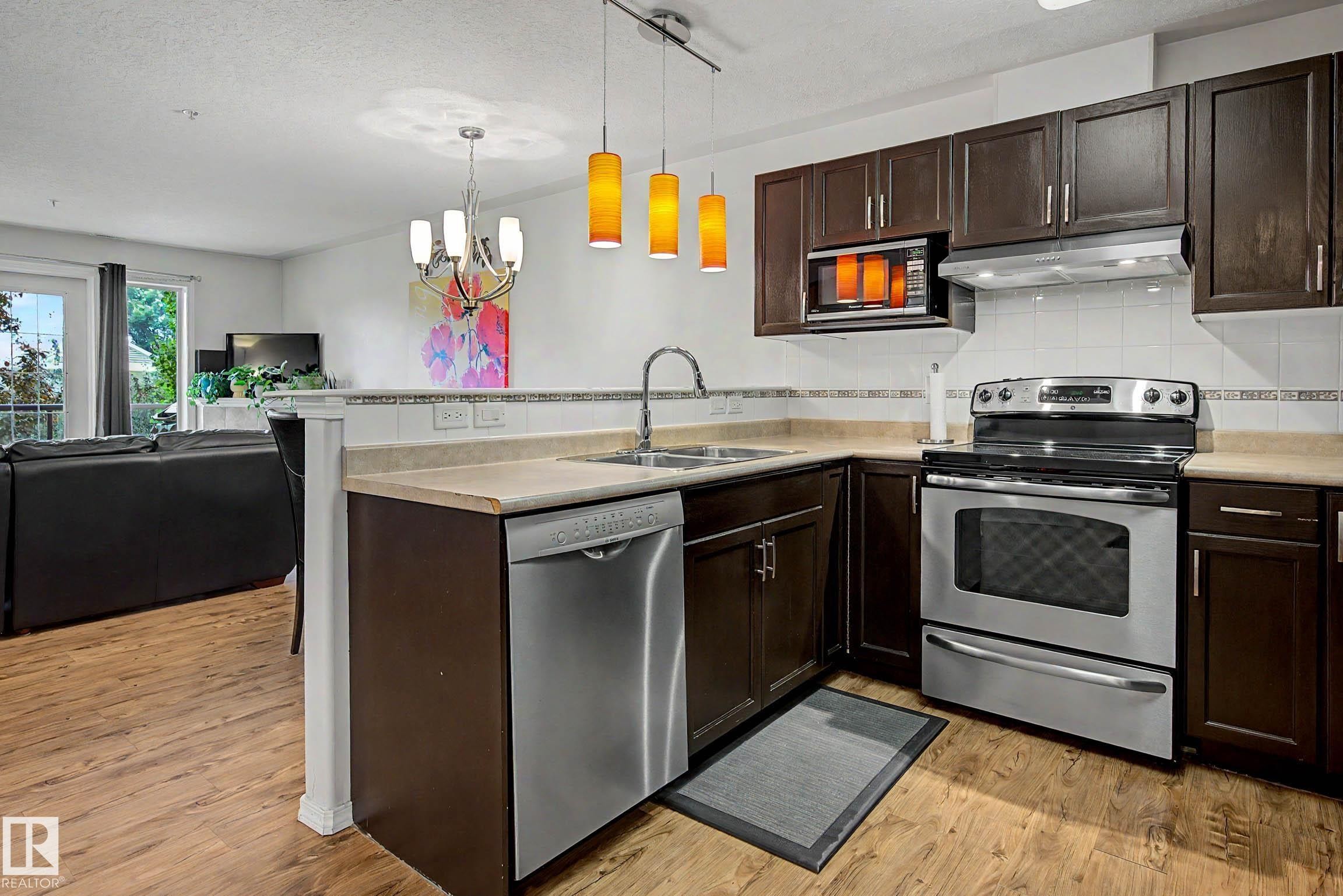 #209 237 Youville Dr E Nw, Edmonton, AB - Indoor Photo Showing Kitchen With Double Sink