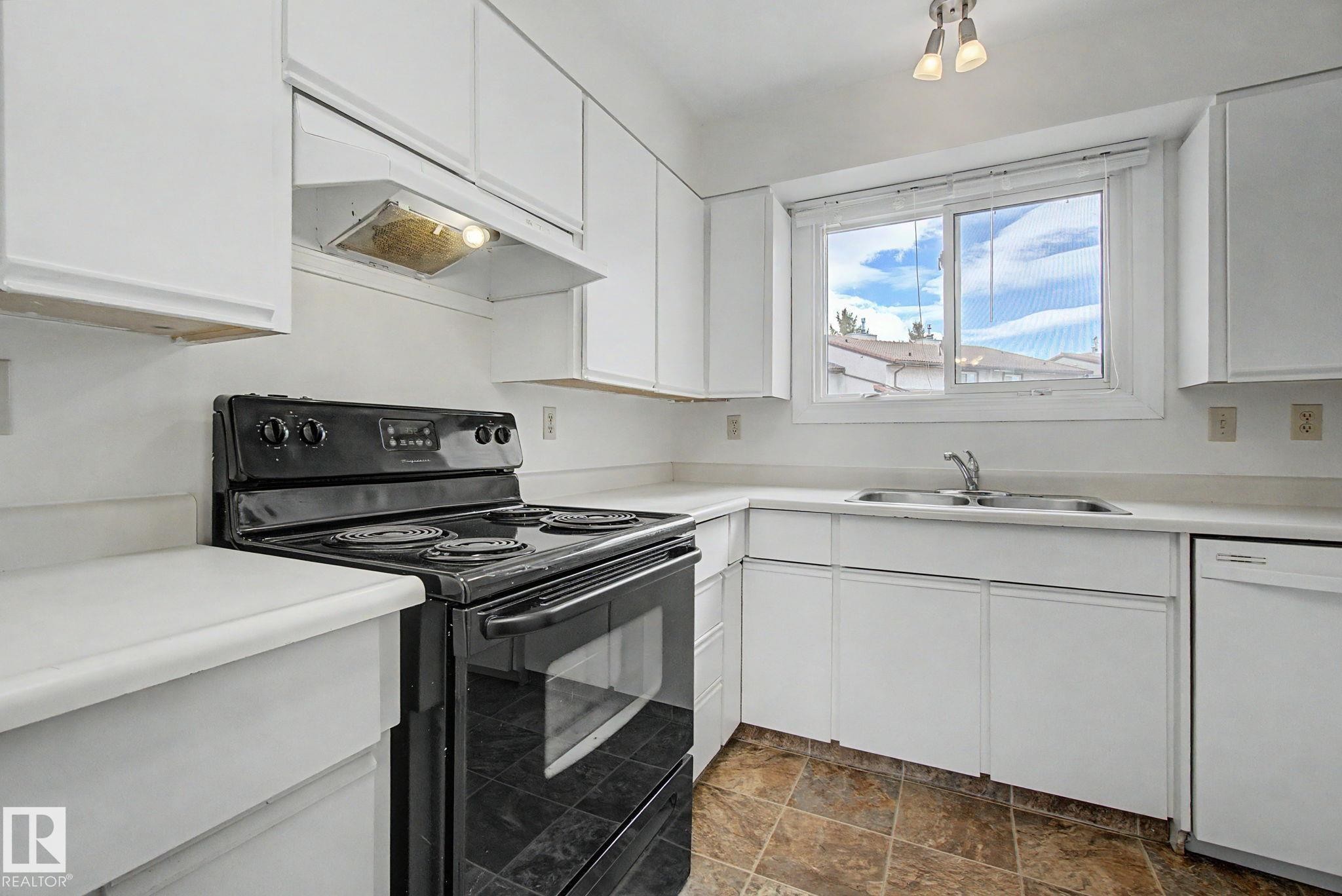 2932 36 Street Nw, Edmonton, AB - Indoor Photo Showing Kitchen With Double Sink