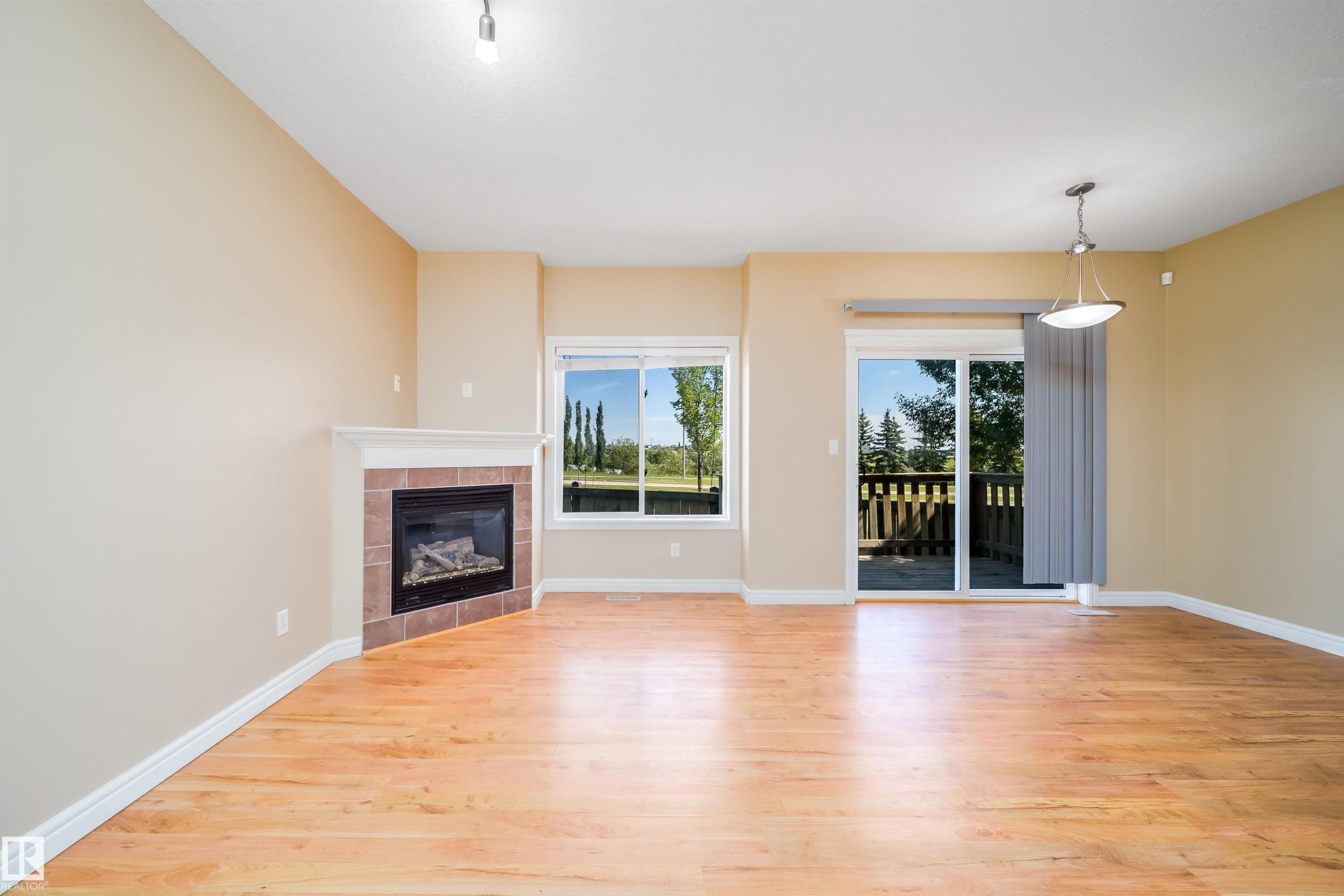 #46 15151 43 St Nw, Edmonton, AB - Indoor Photo Showing Living Room With Fireplace