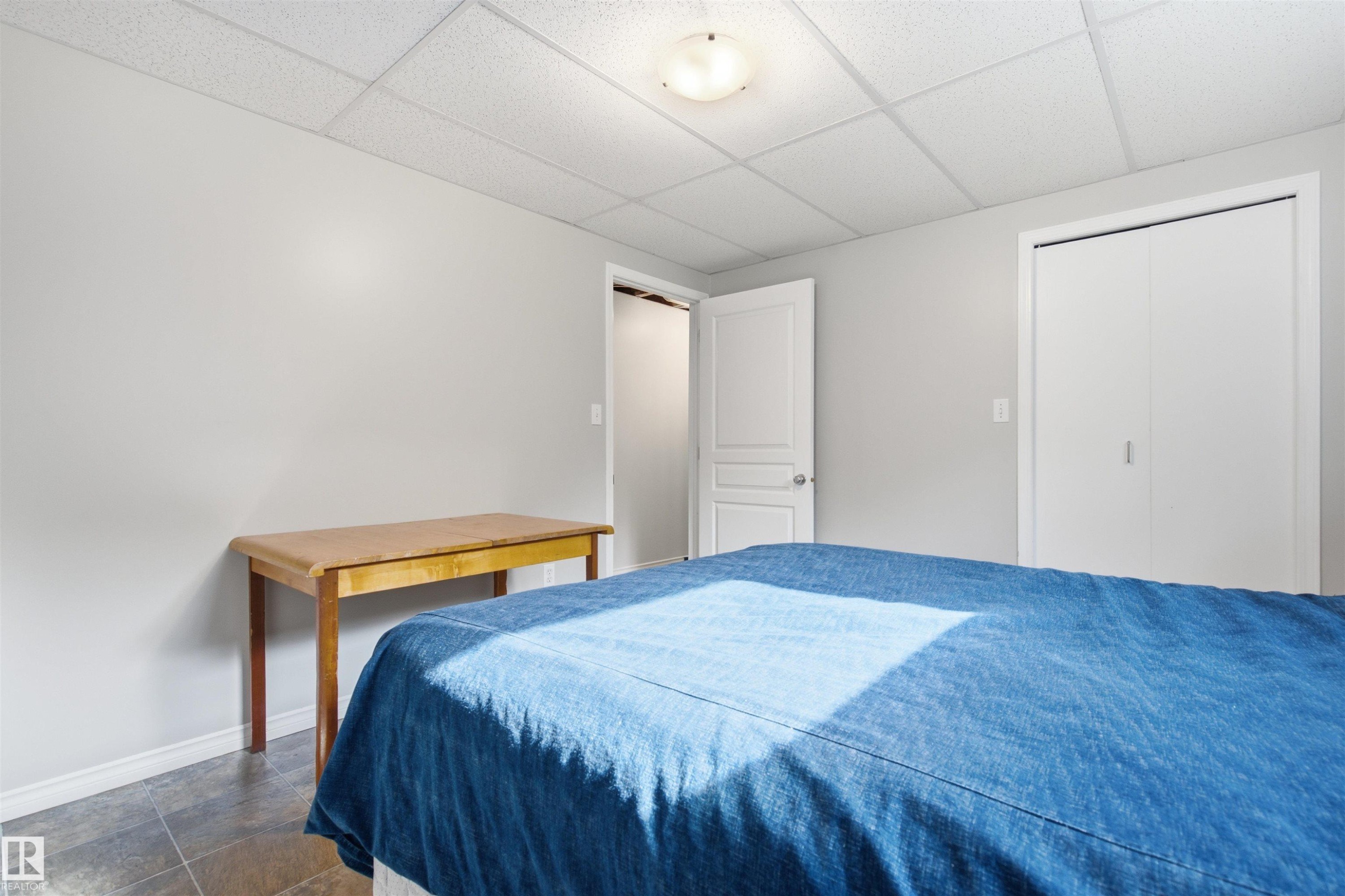 Room with light gray walls and a drop ceiling - 59125 Range Road 102, Rural St. Paul County, AB - Indoor Photo Showing Bedroom