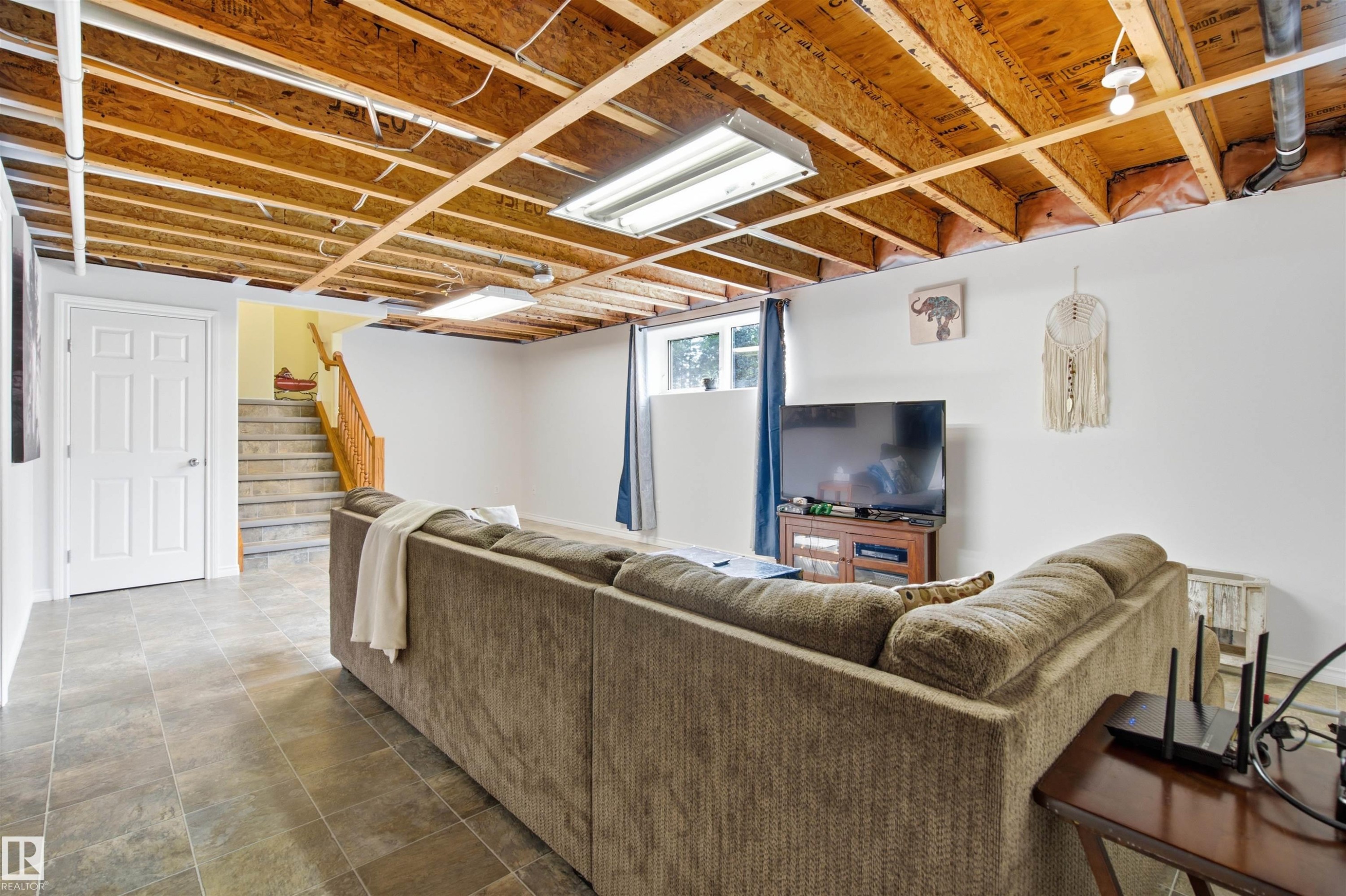 Mostly finished lower level family room - 59125 Range Road 102, Rural St. Paul County, AB - Indoor Photo Showing Basement