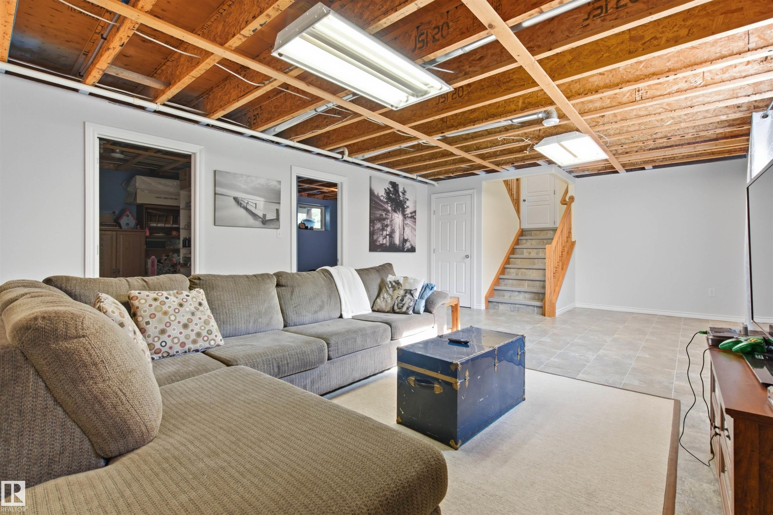 Mostly finished basement family room. - 59125 Range Road 102, Rural St. Paul County, AB - Indoor