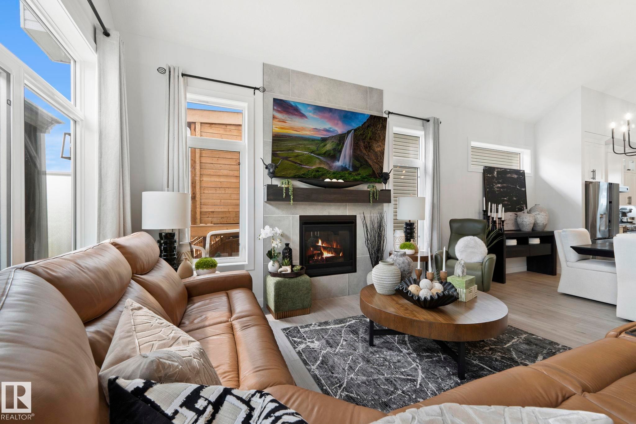 55 Maple Crescent, Gibbons, AB - Indoor Photo Showing Living Room With Fireplace