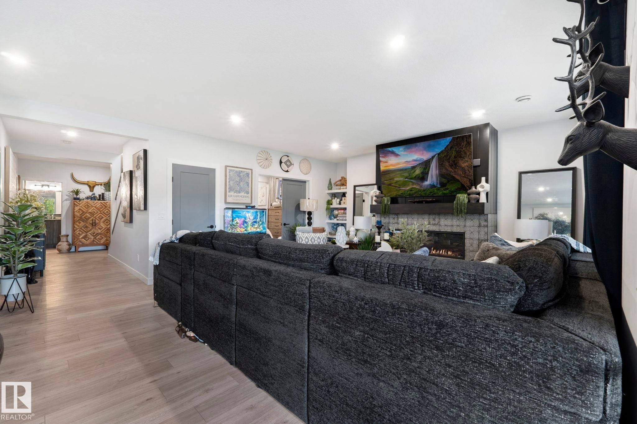 55 Maple Crescent, Gibbons, AB - Indoor Photo Showing Living Room With Fireplace