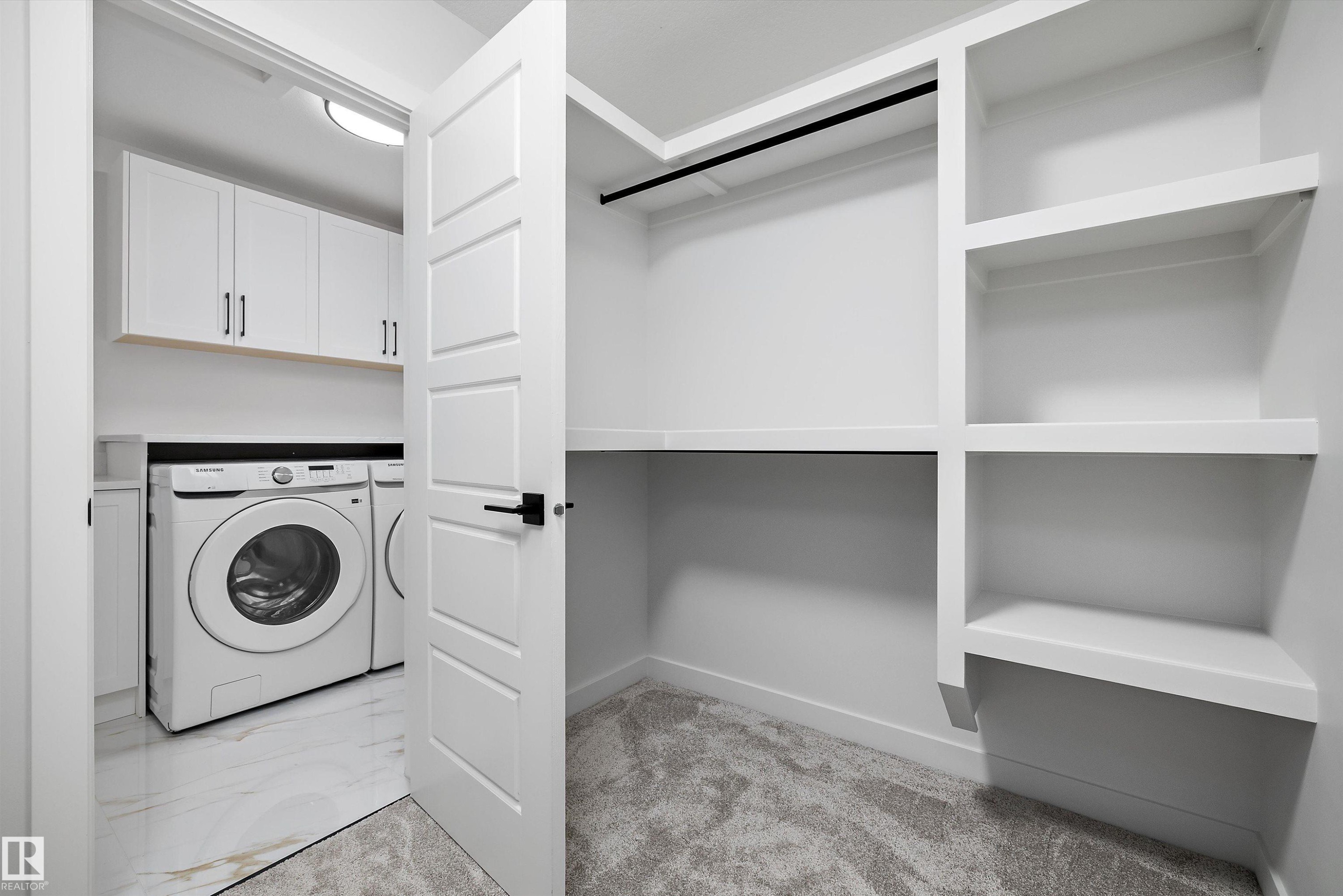 Built-in closet shelving and hanging rod - 971 Elderberry Landing Nw, Edmonton, AB - Indoor Photo Showing Laundry Room
