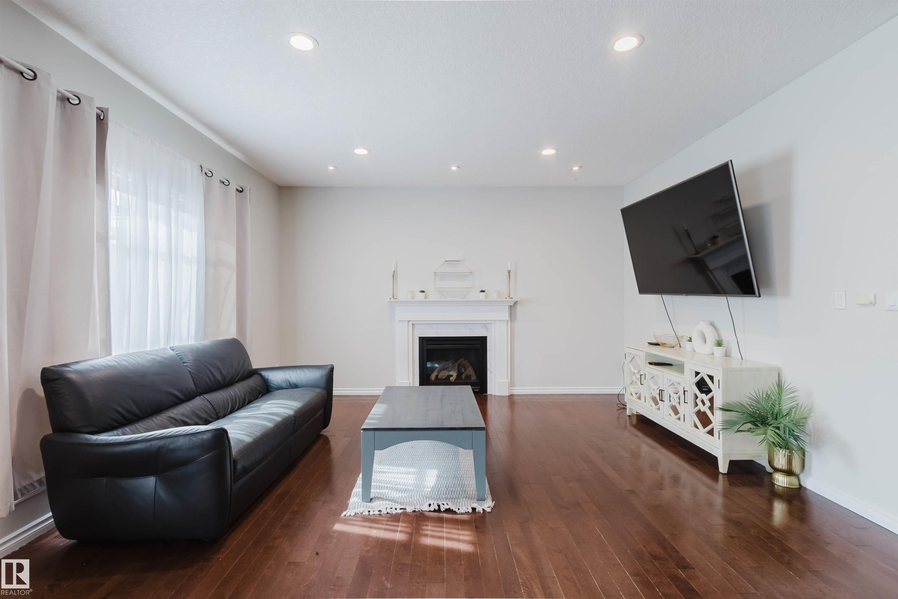 5623 206 Street Nw, Edmonton, AB - Indoor Photo Showing Living Room With Fireplace