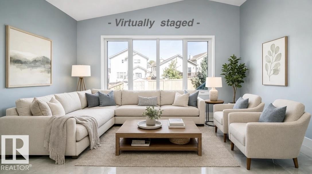 Vaulted ceiling, expansive windows, light blue walls, gray flooring, and white trim - 7848 7 Avenue Sw, Edmonton, AB