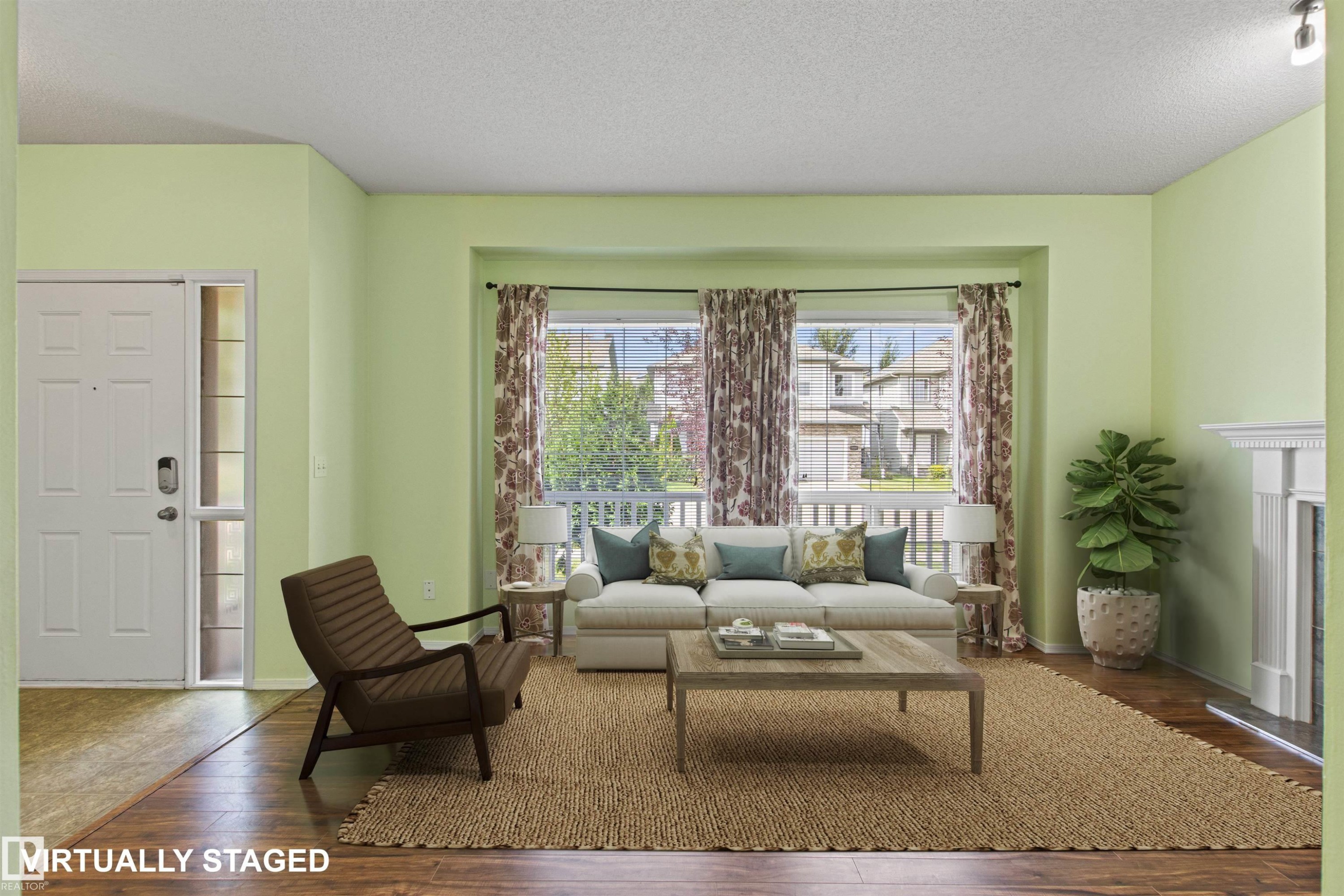 Recessed bay windows provide natural light to the living space, featuring wood-finish flooring and a white decorative fireplace - 9118 Scott Crescent Nw, Edmonton, AB - Indoor Photo Showing Living Room