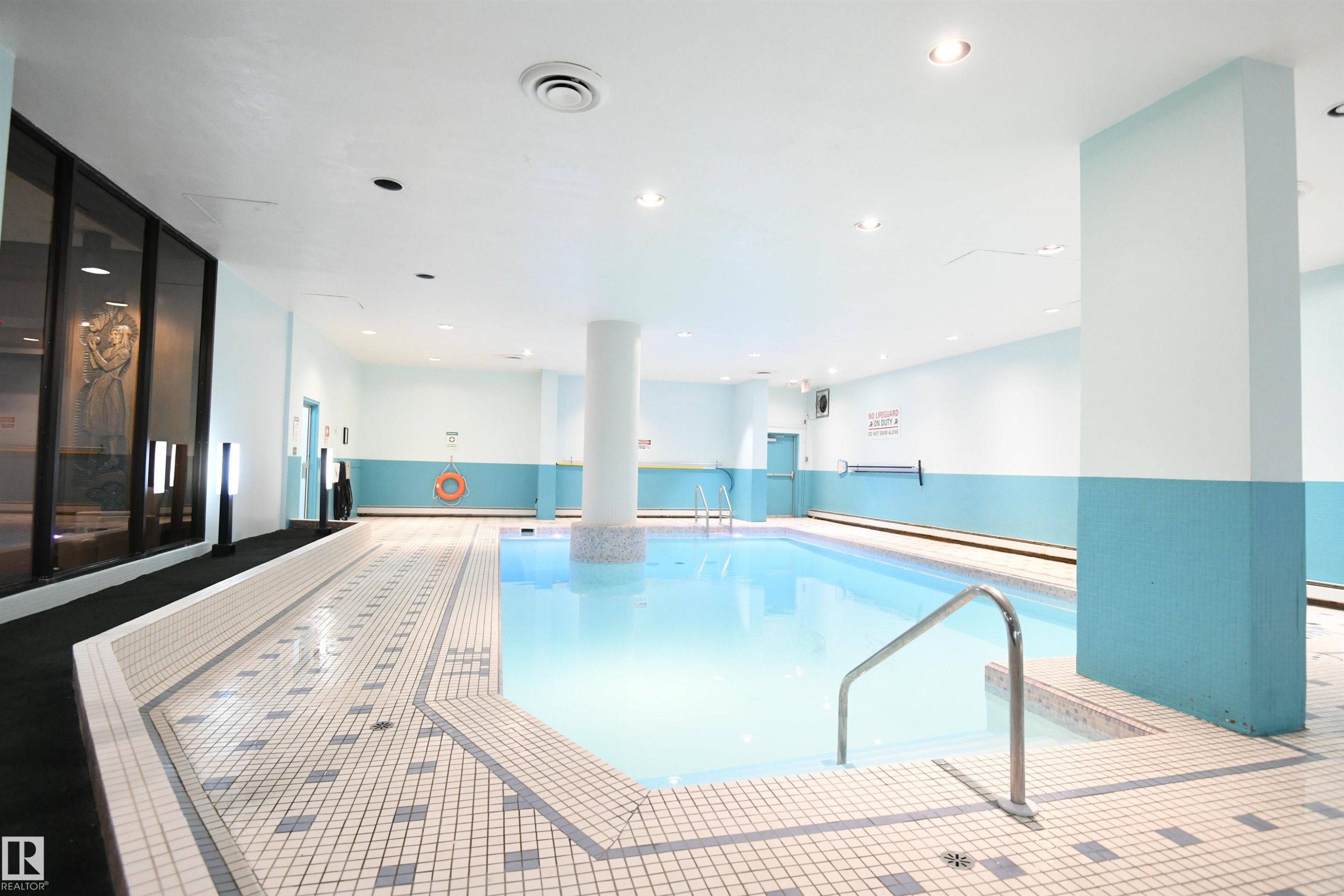 They really don't get much nicer than this. The large salt water pool, with a sauna, is a great place to relax after a long day - #1305 13910 Stony Plain Rd Nw, Edmonton, AB - Indoor Photo Showing Other Room With In Ground Pool