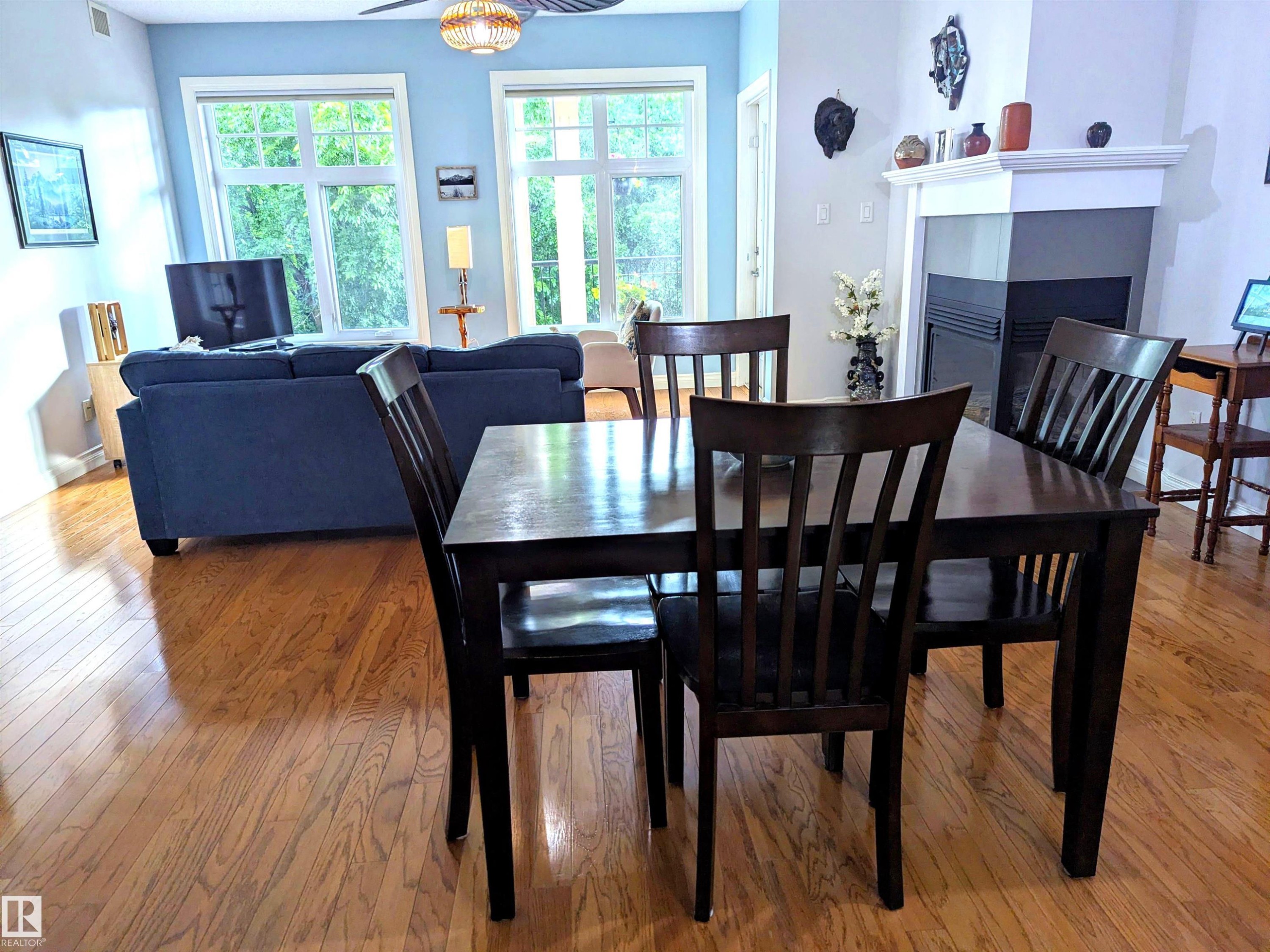 #302 9811 96A St Nw, Edmonton, AB - Indoor Photo Showing Dining Room With Fireplace