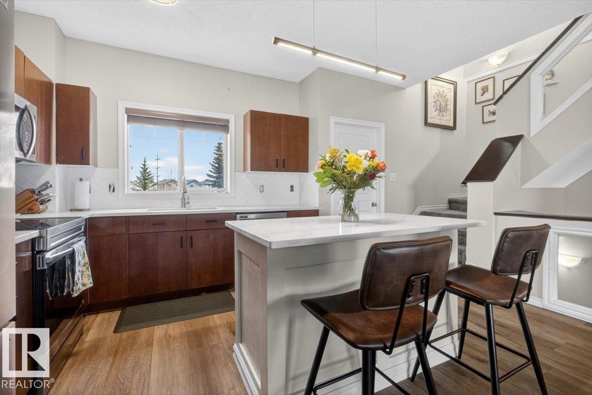 #76 3010 33 Av Nw, Edmonton, AB - Indoor Photo Showing Kitchen With Double Sink