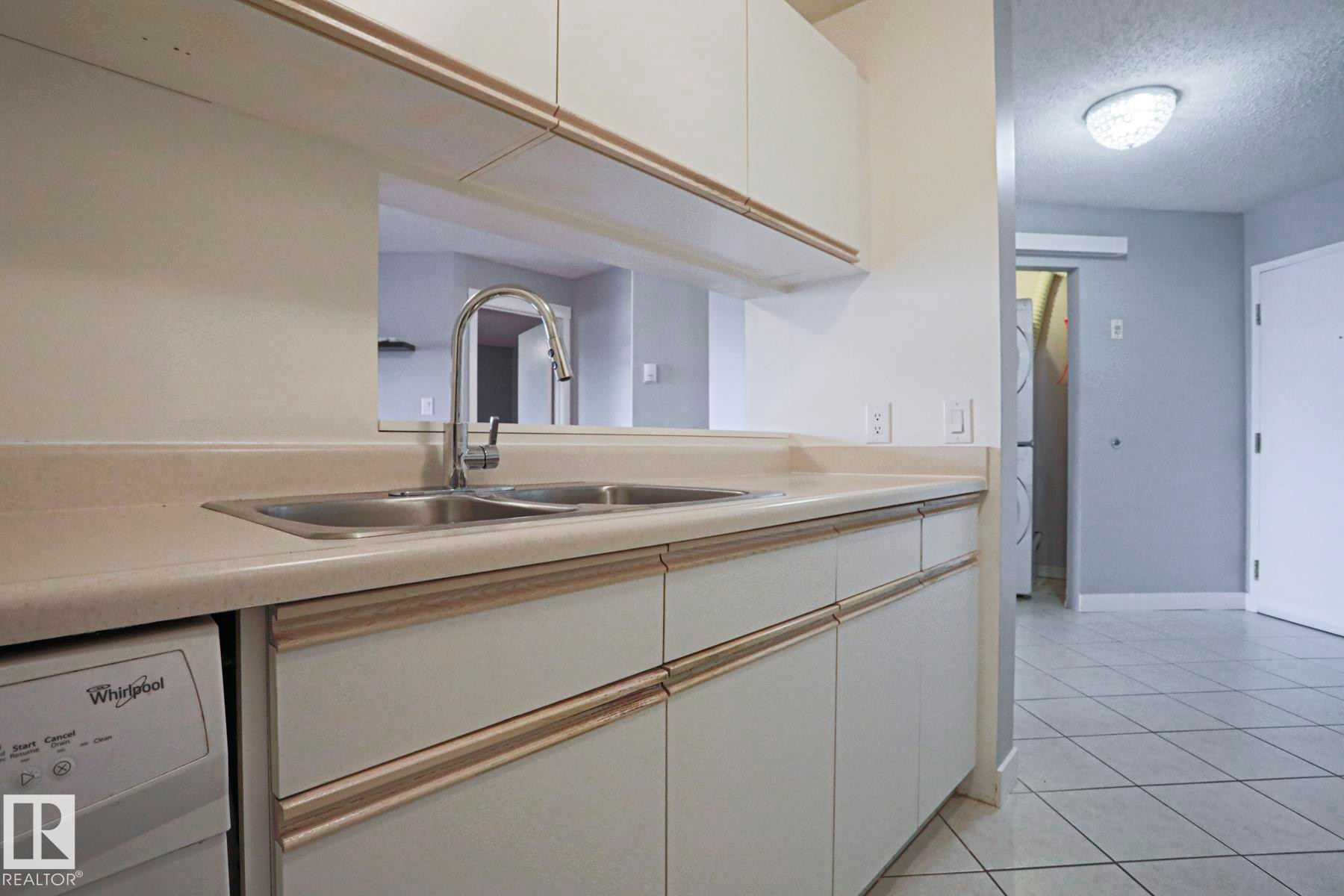 #208 6710 158 Av Nw, Edmonton, AB - Indoor Photo Showing Kitchen With Double Sink