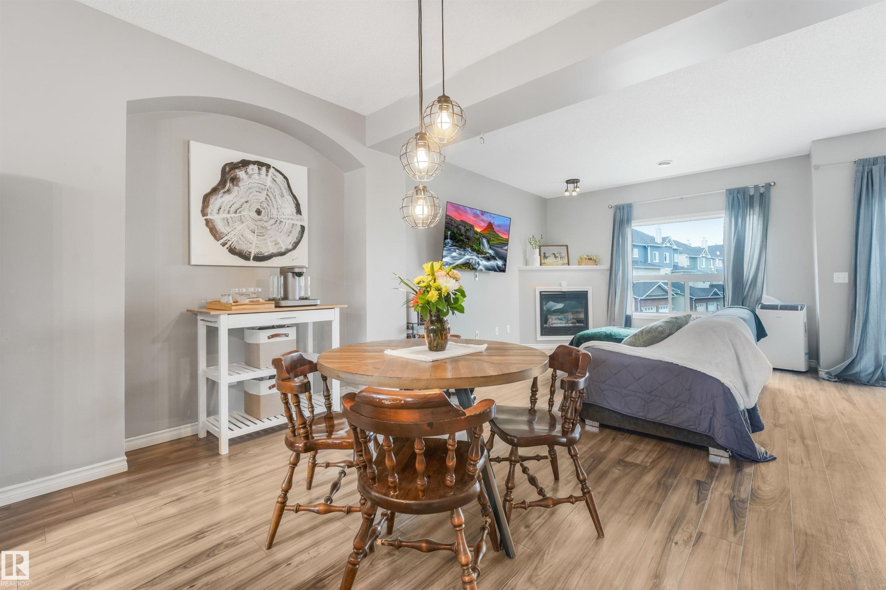 #33 3010 33 Av Nw, Edmonton, AB - Indoor Photo Showing Dining Room With Fireplace