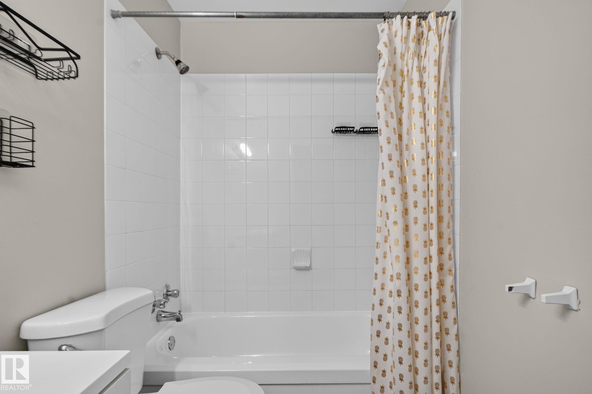 Bathtub with white subway tile surround and chrome fixtures - 17775 95 Street Nw, Edmonton, AB - Indoor Photo Showing Bathroom