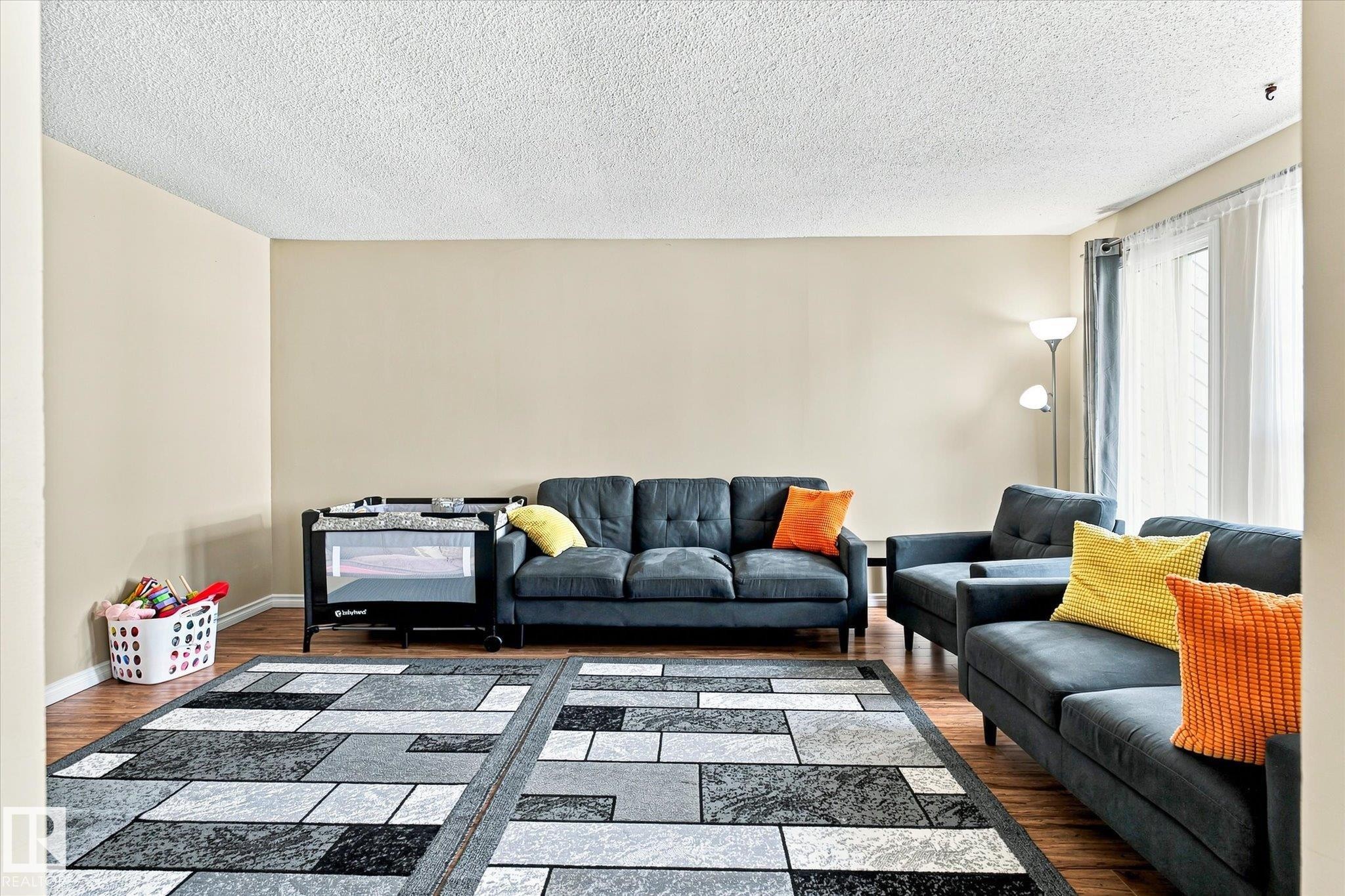 Additional content - 6471 180 Street Nw, Edmonton, AB - Indoor Photo Showing Living Room