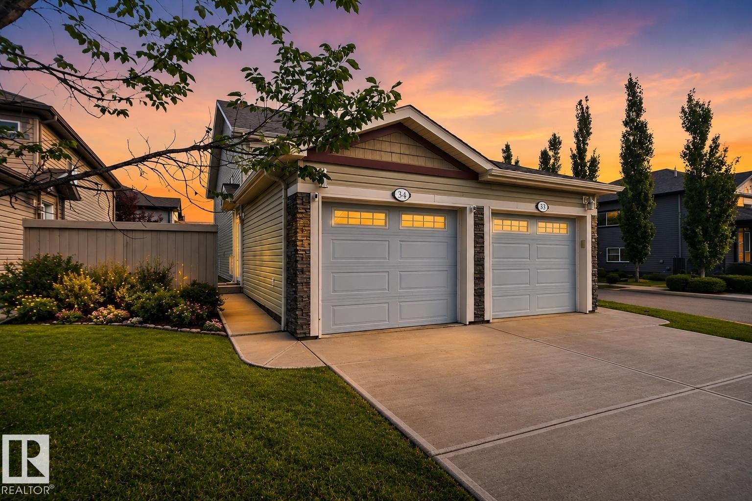 Attached two-car garage with overhead lighting and window inserts - #34 6520 2 Av Sw, Edmonton, AB - Outdoor