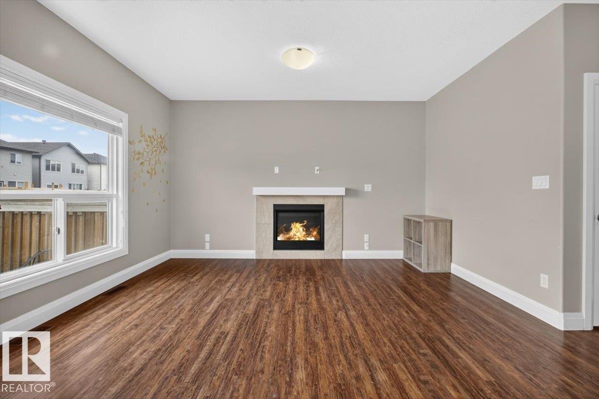 2005 15 Avenue Nw, Edmonton, AB - Indoor Photo Showing Living Room With Fireplace