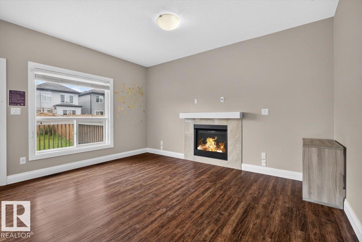 2005 15 Avenue Nw, Edmonton, AB - Indoor Photo Showing Living Room With Fireplace