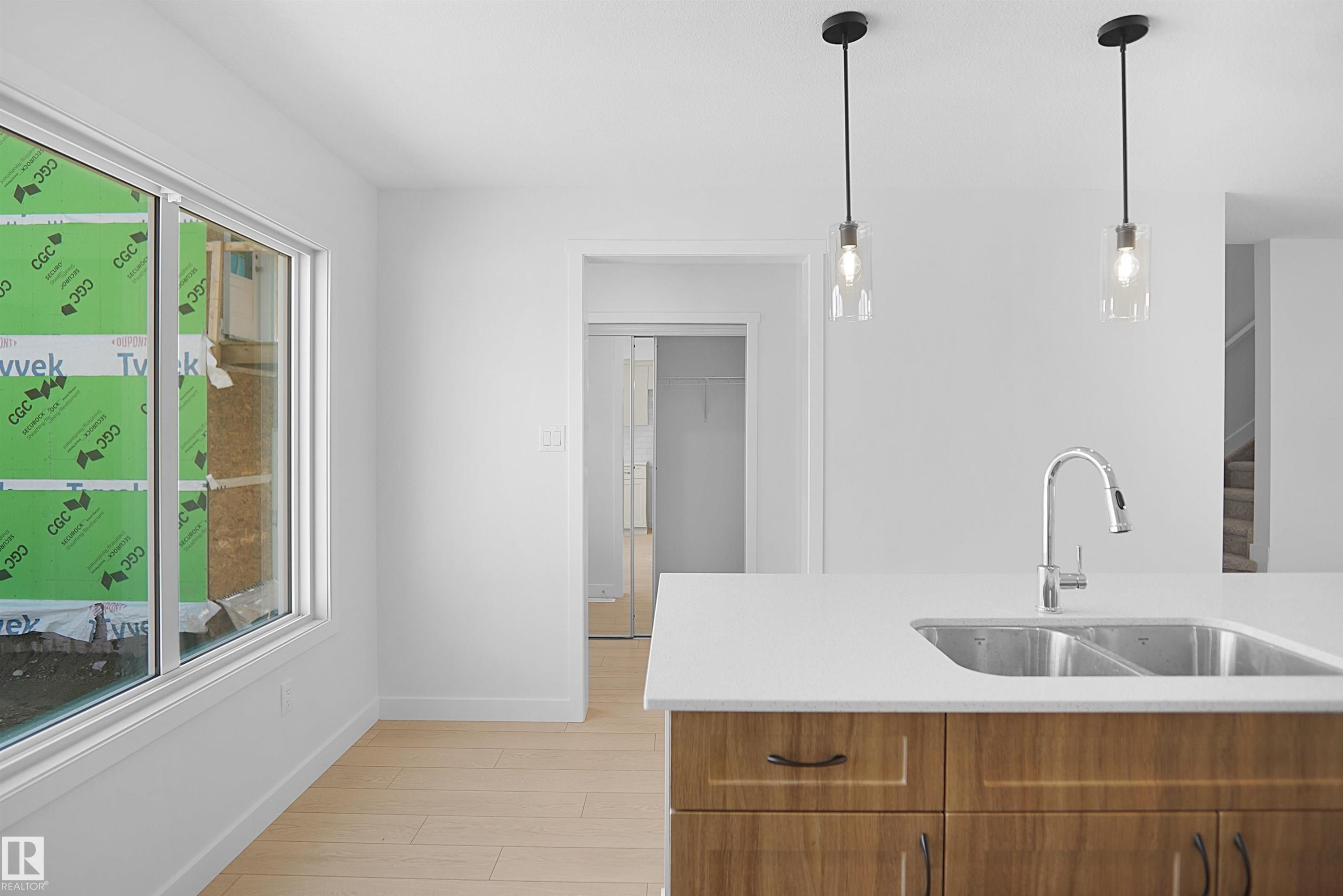 546 Ashgrove Circle, Leduc, AB - Indoor Photo Showing Kitchen With Double Sink