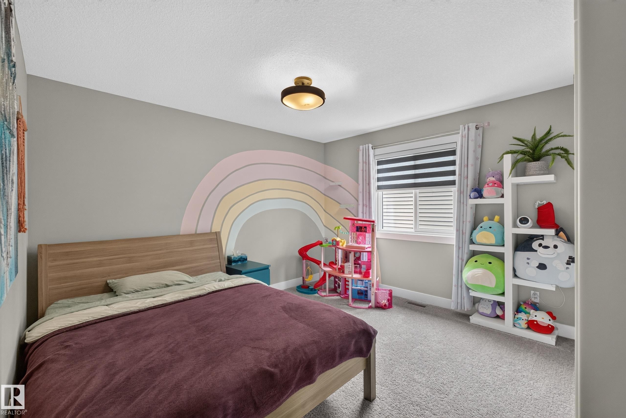 Neutral wall color, window with horizontal blinds, built-in shelving, carpeted flooring, and a ceiling-mounted light fixture - 1399 Graydon Hill Way Sw, Edmonton, AB