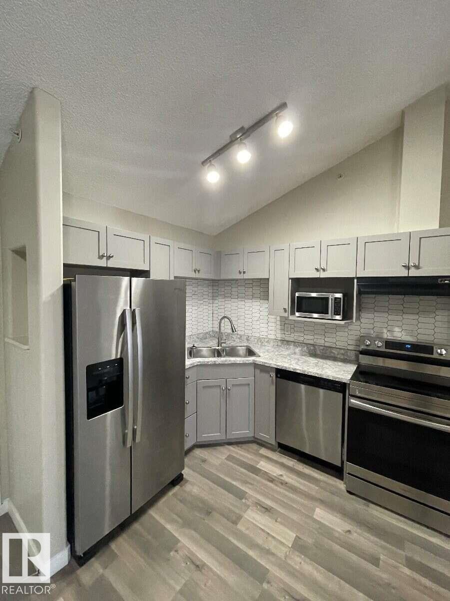 #405 151 Edwards Dr Sw, Edmonton, AB - Indoor Photo Showing Kitchen With Double Sink
