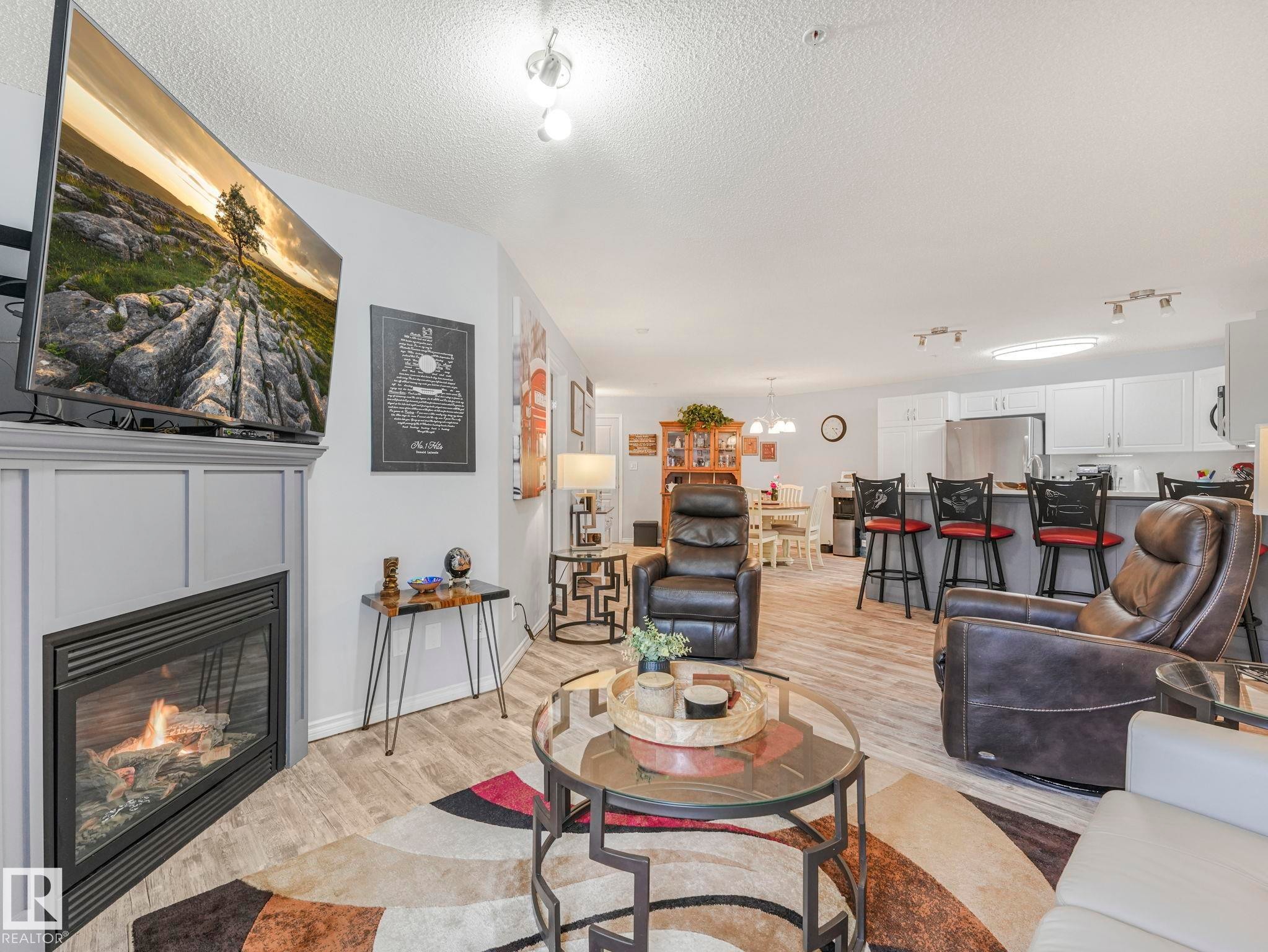 #208 16035 132 St Nw, Edmonton, AB - Indoor Photo Showing Living Room With Fireplace