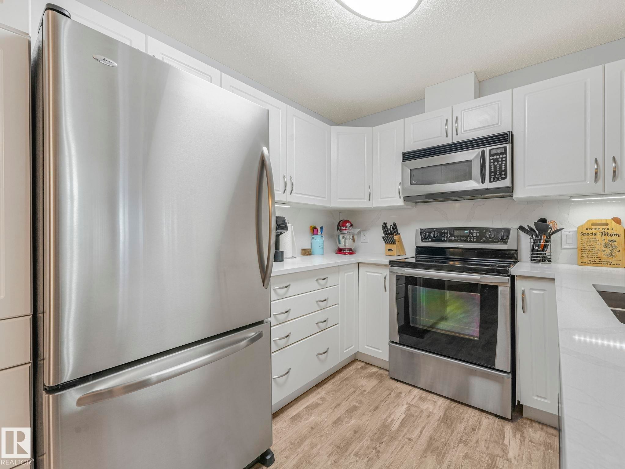 #208 16035 132 St Nw, Edmonton, AB - Indoor Photo Showing Kitchen With Stainless Steel Kitchen