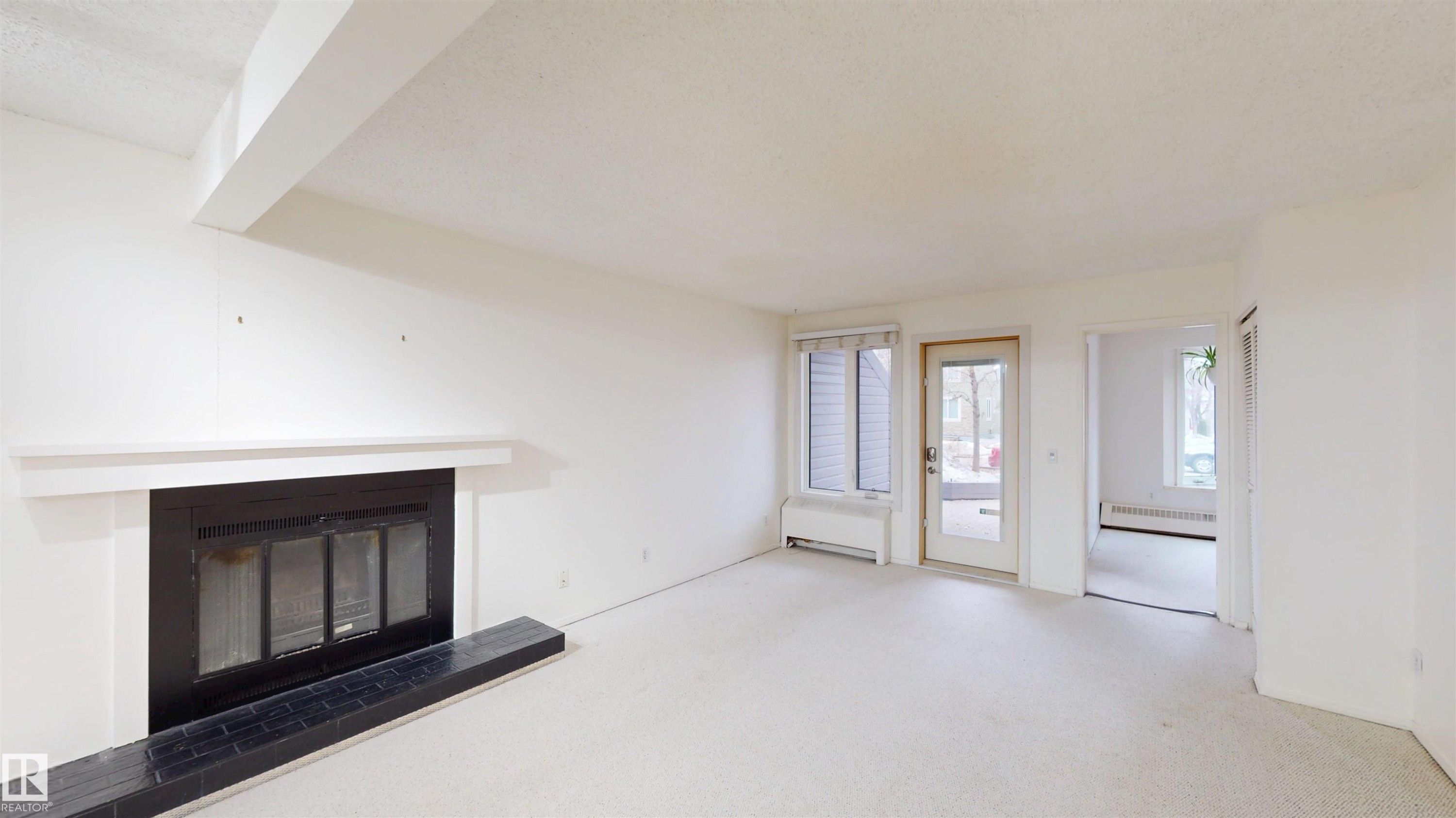 #109 11115 80 Av Nw, Edmonton, AB - Indoor With Fireplace