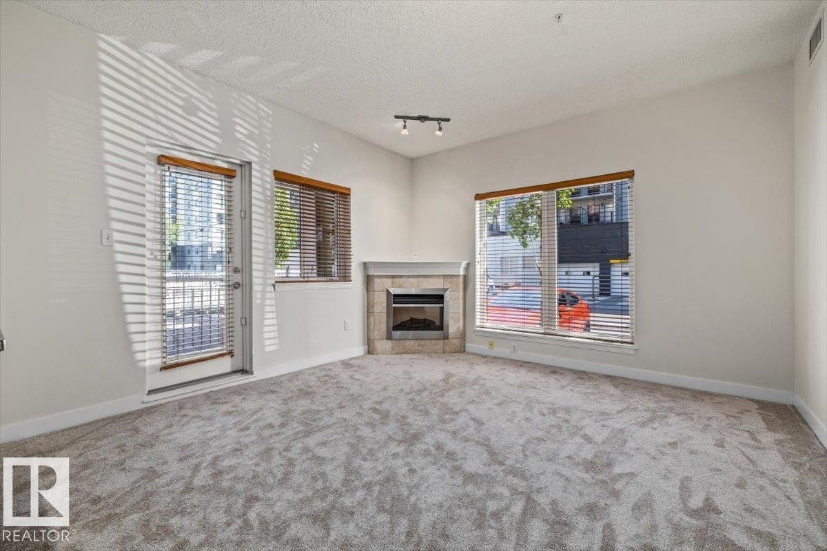 #118 10333 112 St Nw, Edmonton, AB - Indoor With Fireplace