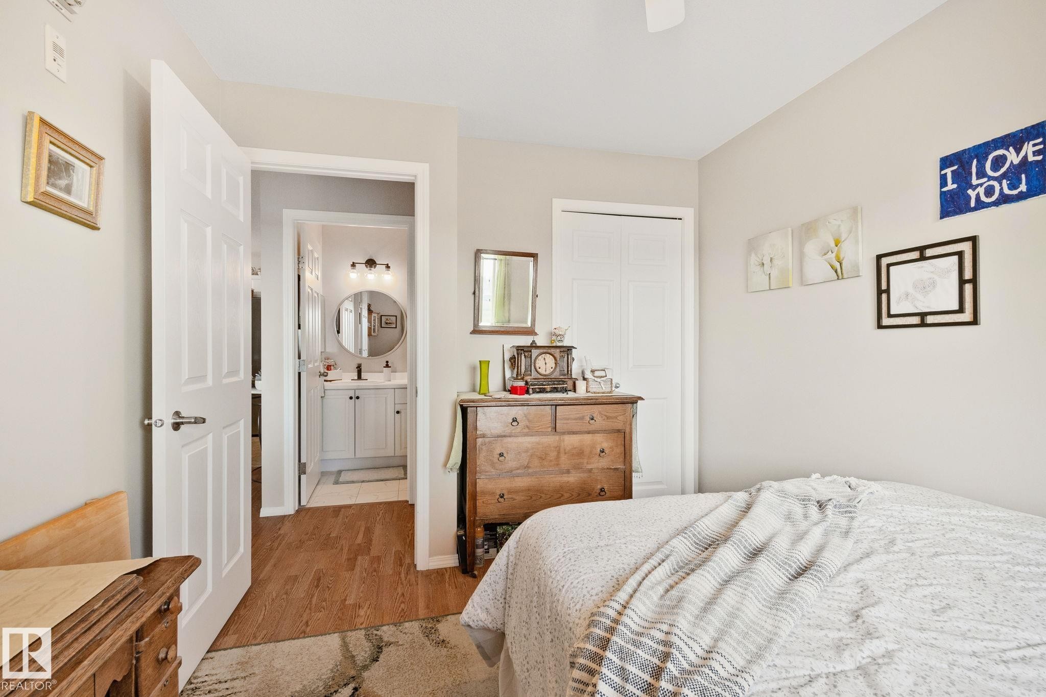 Neutral wall paint, white paneled doors, and a ceiling fan - #407 4309 33 St, Stony Plain, AB - Indoor Photo Showing Bedroom