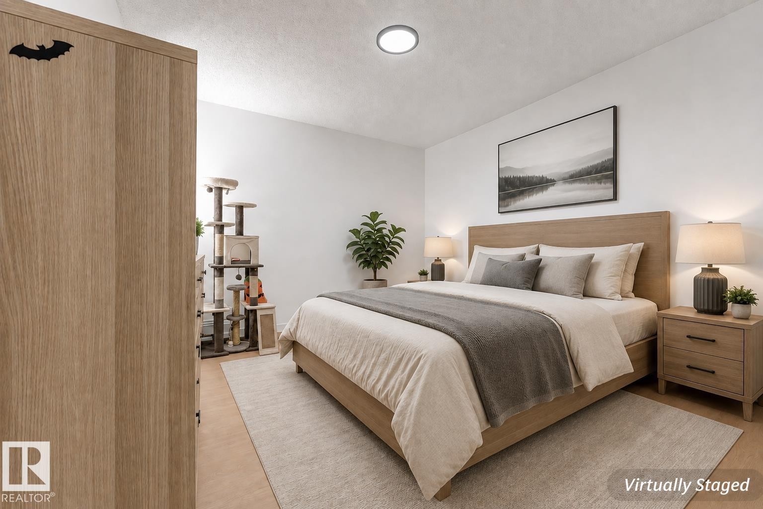 Wood-finish flooring with a neutral area rug - #416 2305 35A Av Nw, Edmonton, AB - Indoor Photo Showing Bedroom
