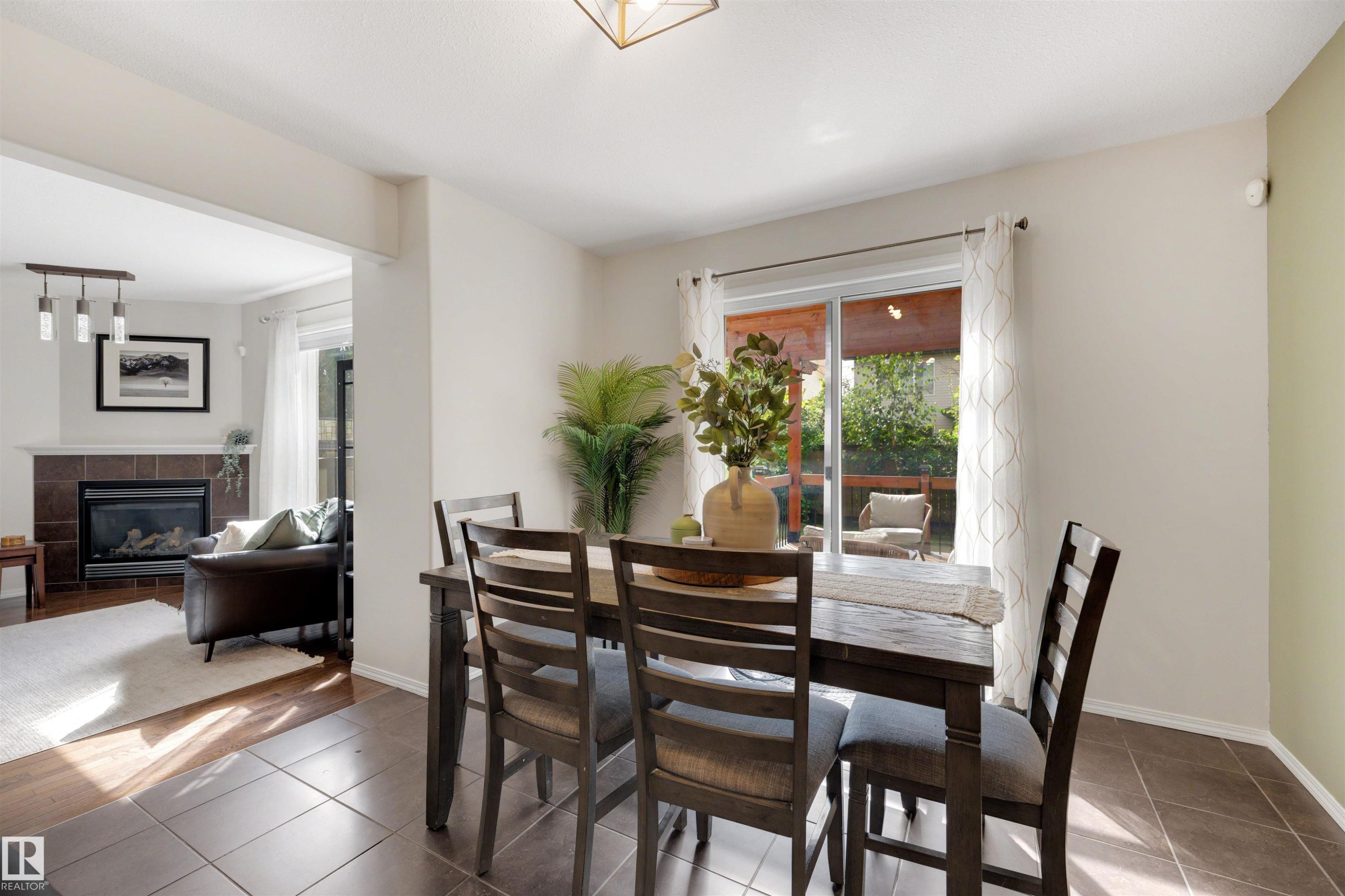 728 173 Street Sw, Edmonton, AB - Indoor Photo Showing Dining Room With Fireplace