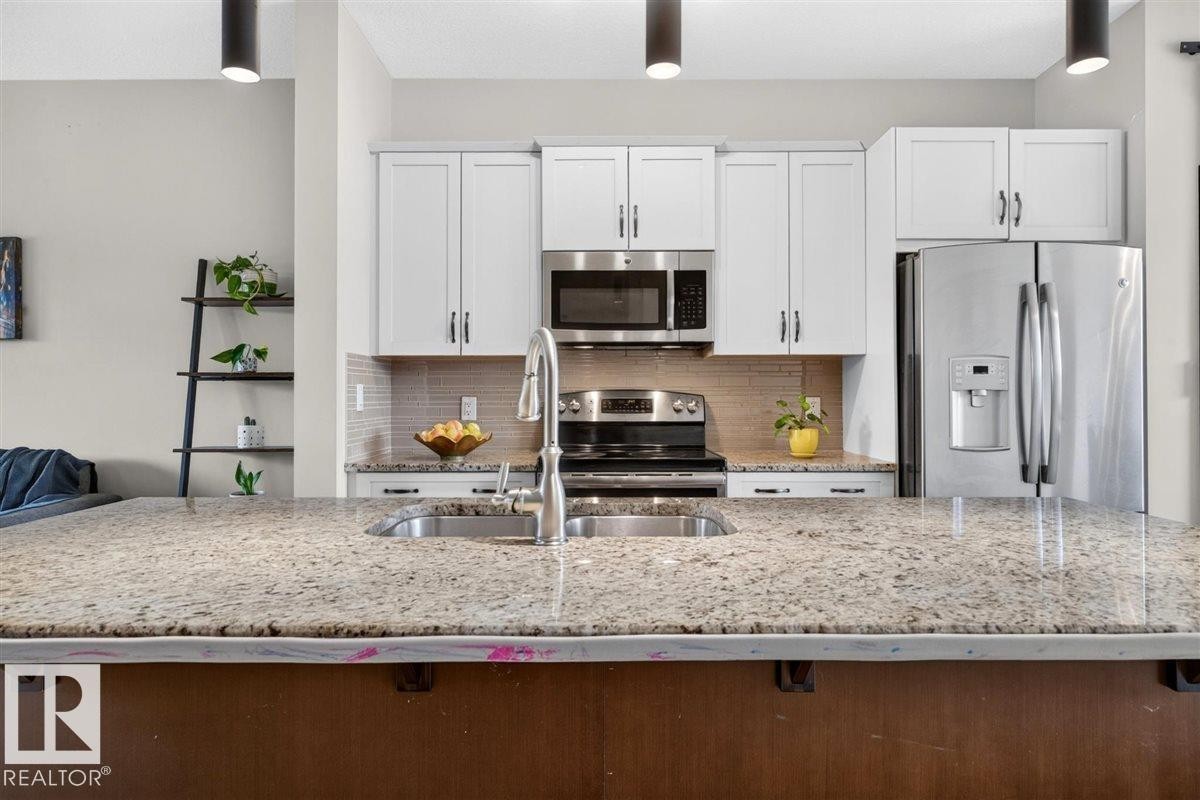 3150 Carpenter Landing Sw, Edmonton, AB - Indoor Photo Showing Kitchen With Stainless Steel Kitchen With Double Sink With Upgraded Kitchen