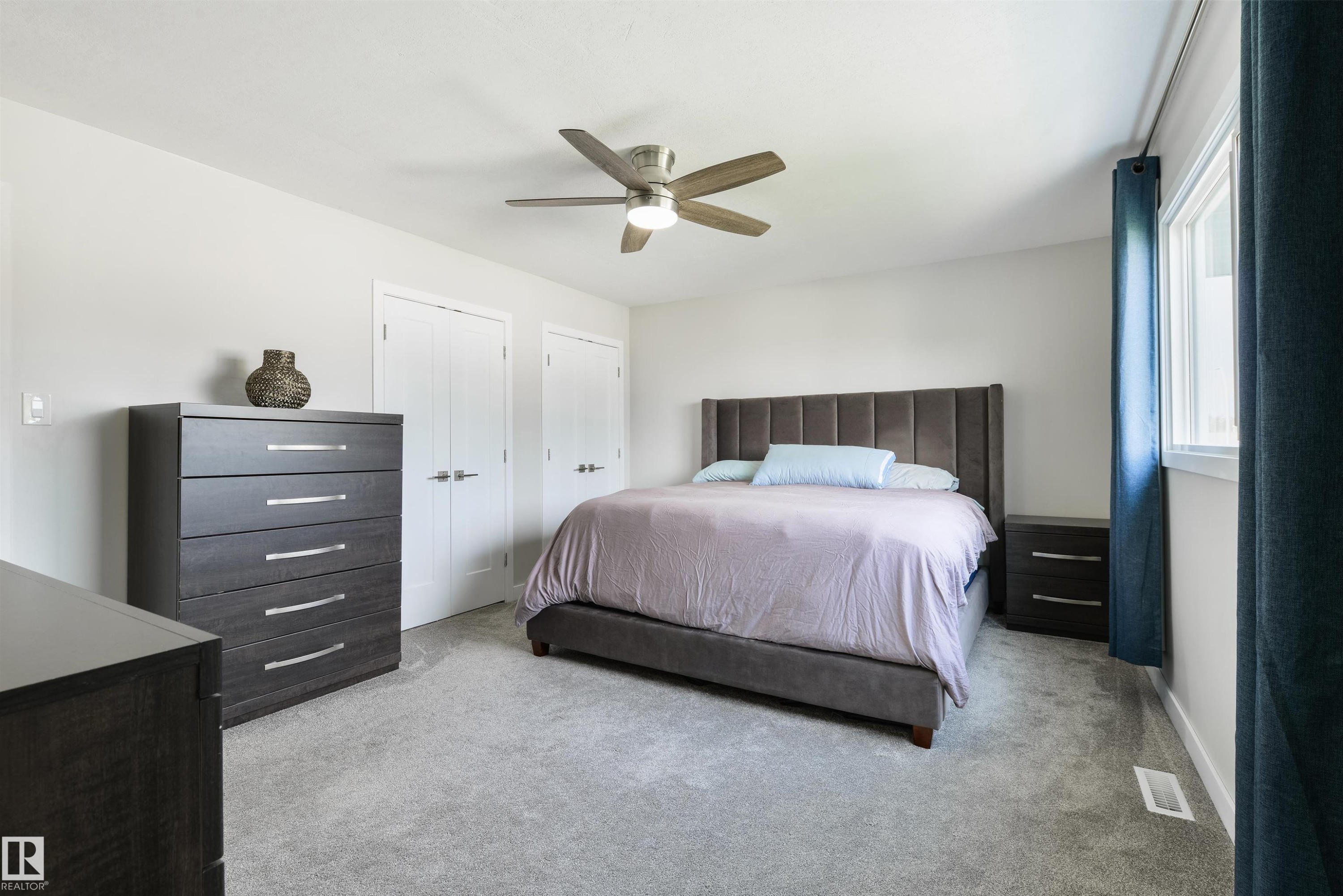 Recessed lighting, ceiling fan with light fixture, light gray carpeting, and multiple windows - 4614 53 Ave, Calmar, AB - Indoor Photo Showing Bedroom