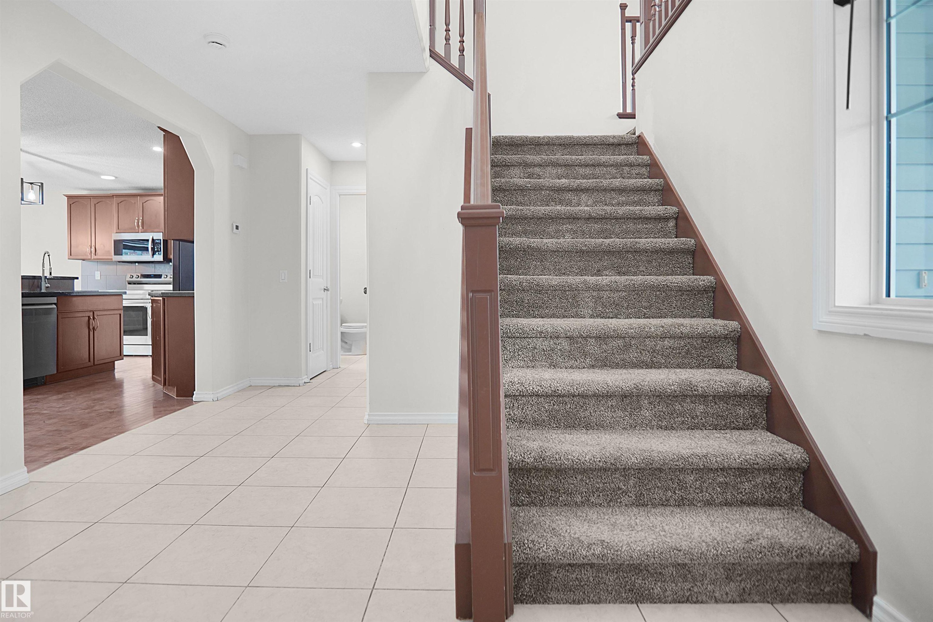 Welcoming foyer with ceramic tile flooring and open layout - 8432 18 Avenue Sw, Edmonton, AB - Indoor Photo Showing Other Room