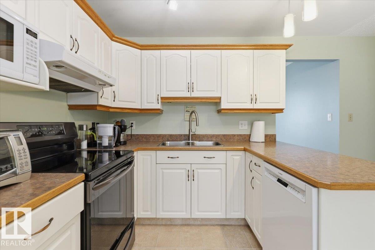 128 Green Ash Drive, Wetaskiwin, AB - Indoor Photo Showing Kitchen With Double Sink