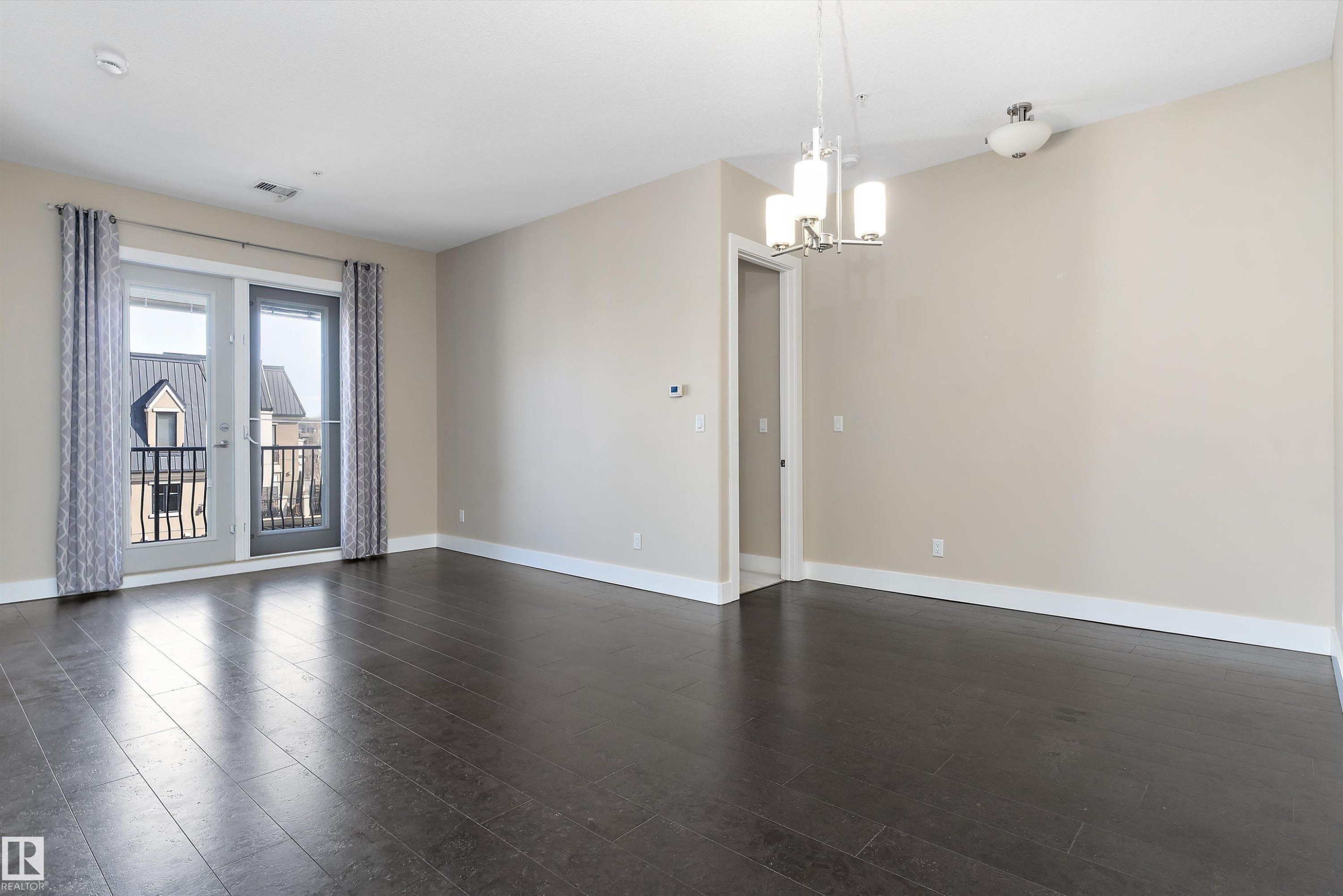 #449 6079 Maynard Wy Nw, Edmonton, AB - Indoor Photo Showing Other Room