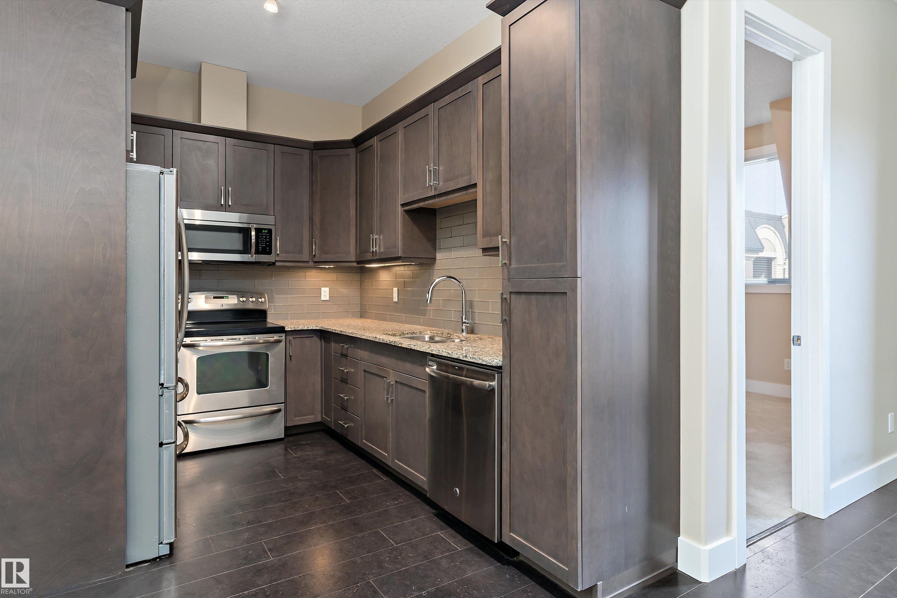 #449 6079 Maynard Wy Nw, Edmonton, AB - Indoor Photo Showing Kitchen With Upgraded Kitchen