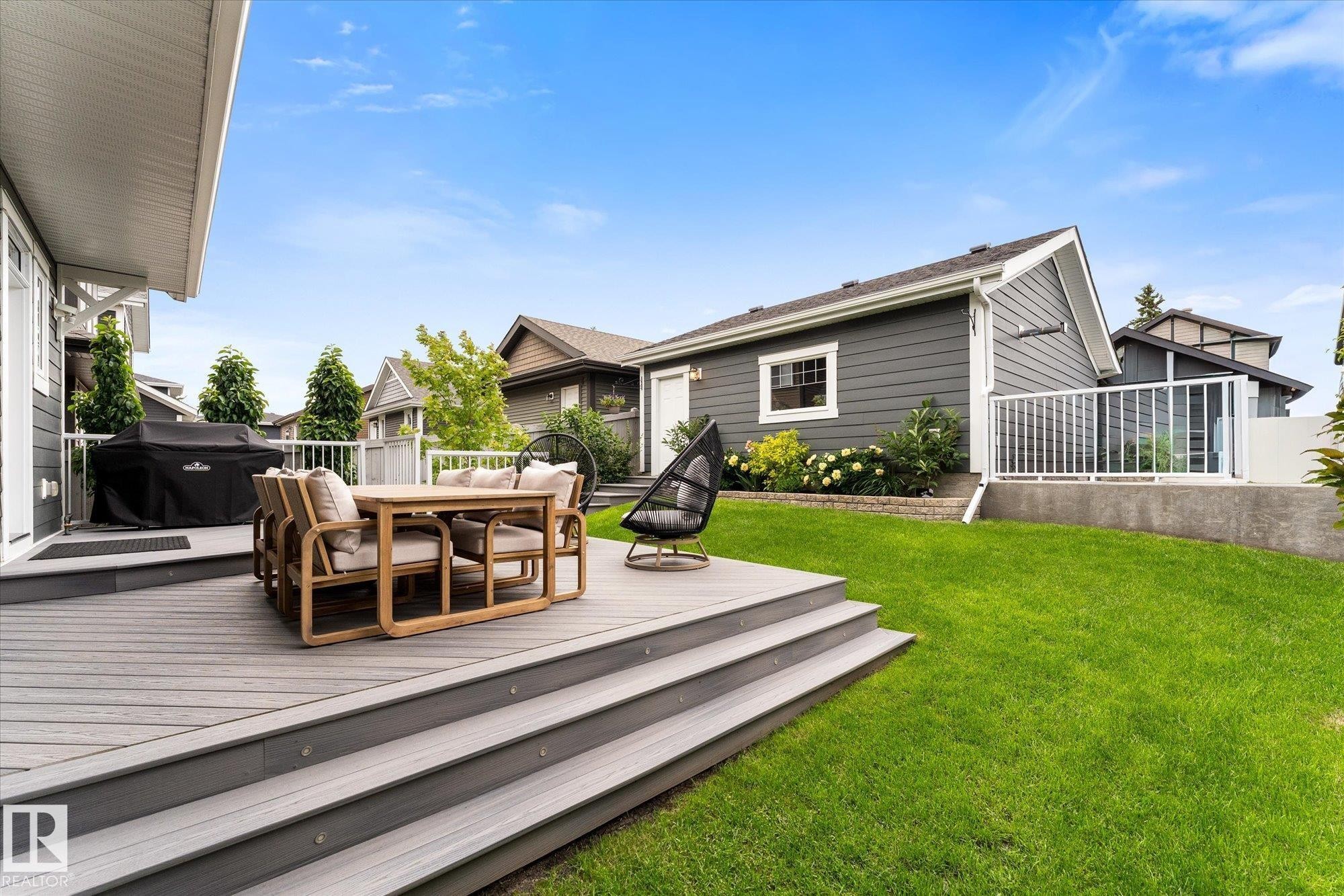 Multi-level composite deck with integrated stair lighting - 5616 Juchli Avenue Nw, Edmonton, AB - Outdoor With Deck Patio Veranda With Exterior