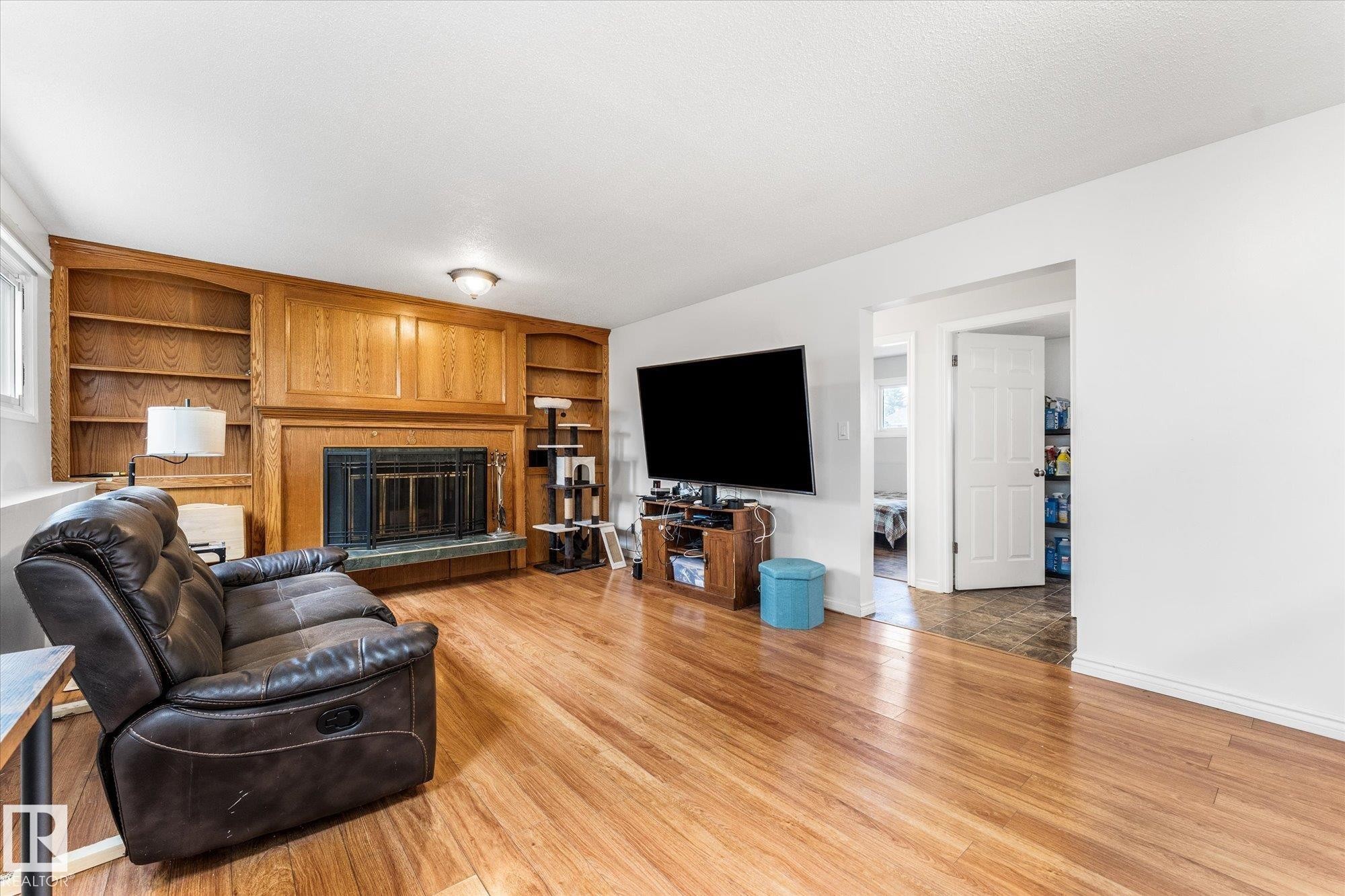 3 Windermere Drive, Spruce Grove, AB - Indoor Photo Showing Living Room With Fireplace